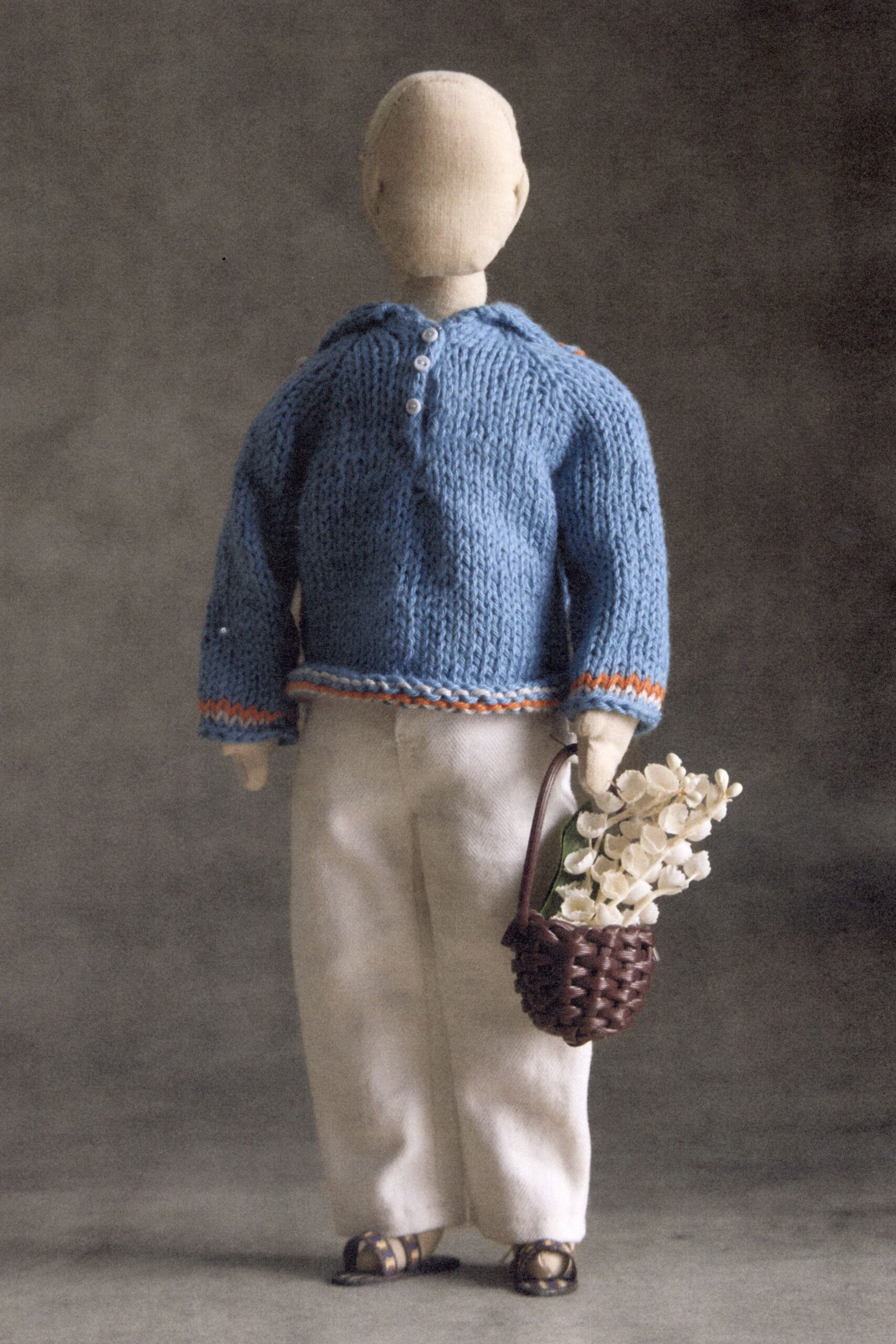 blue knit long-sleeve high-neck oversized striped buttoned sweater
