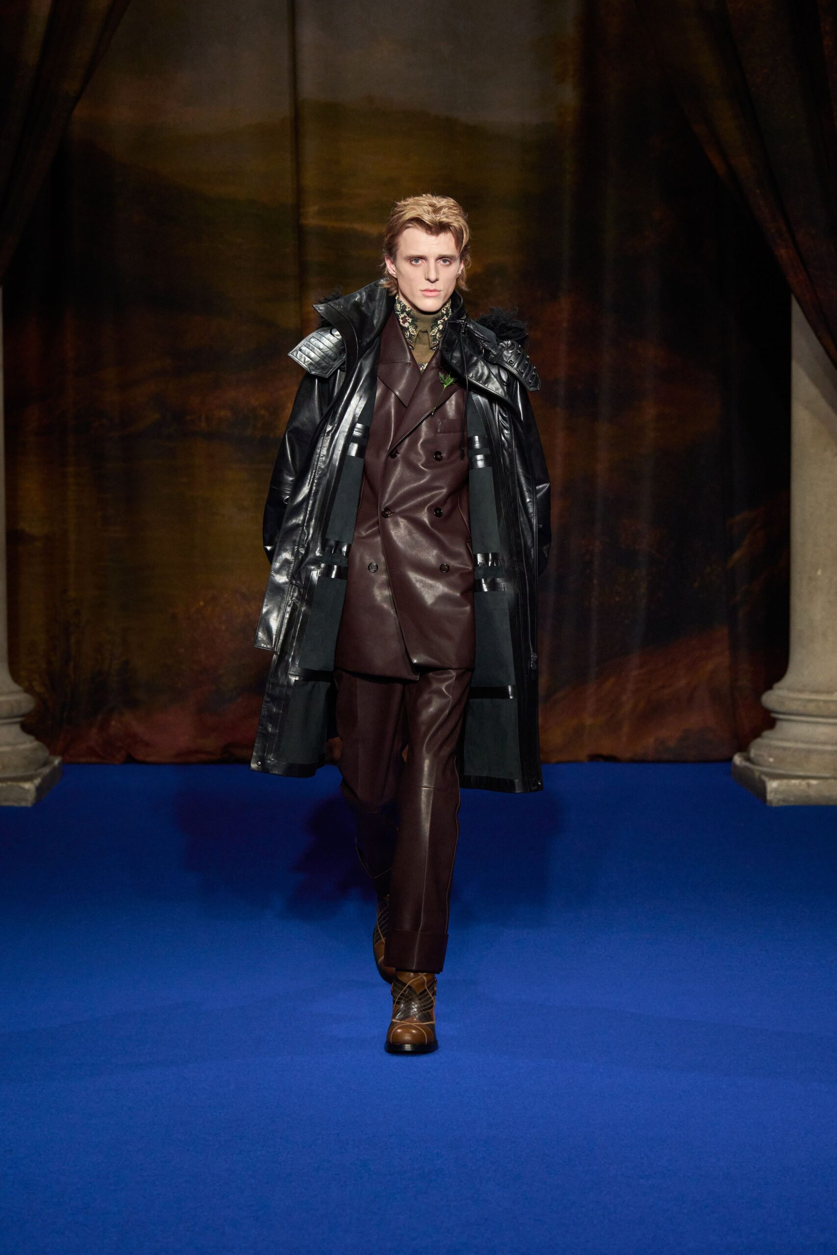 black leather coat and brown suit