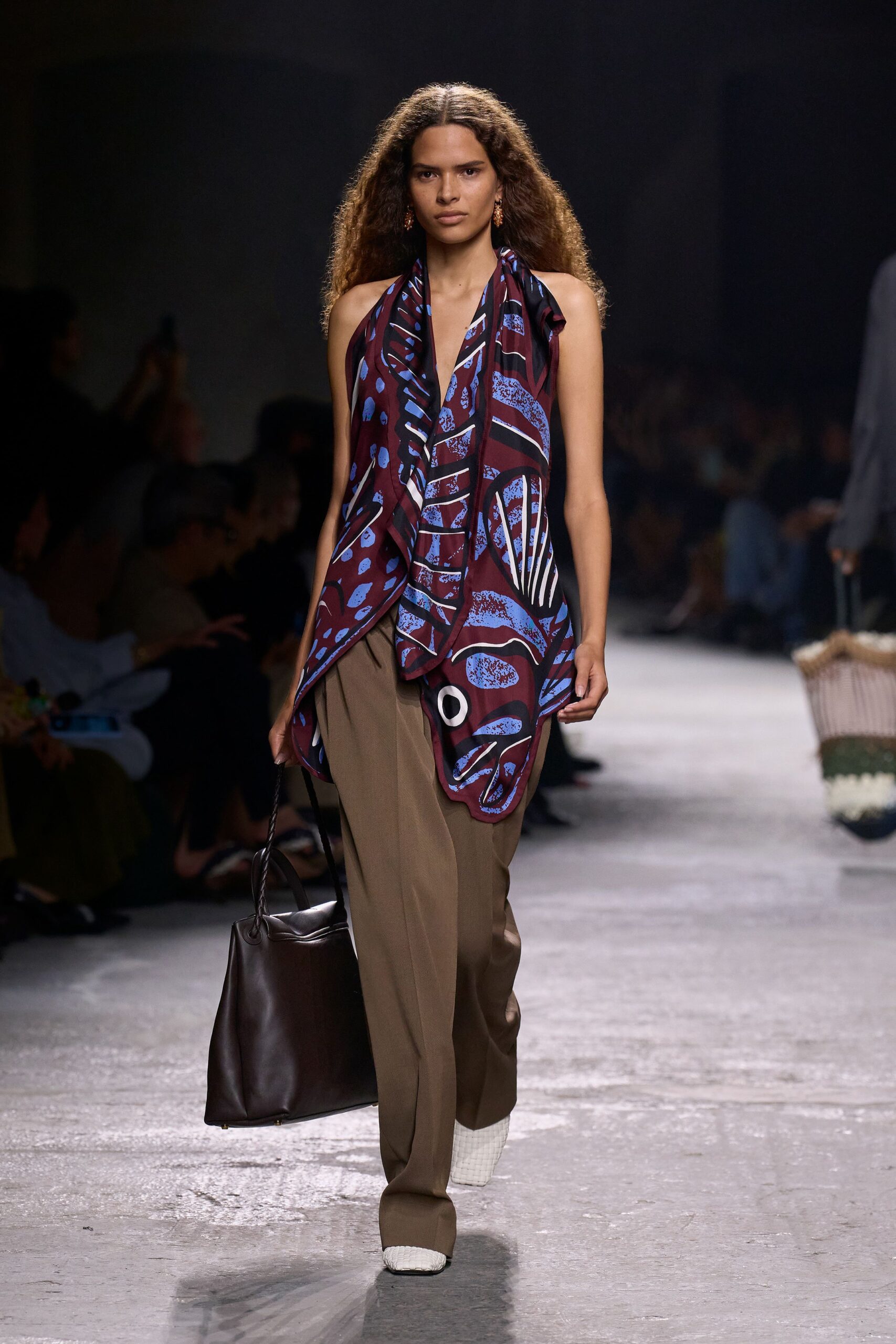 purple printed silk top with brown pants