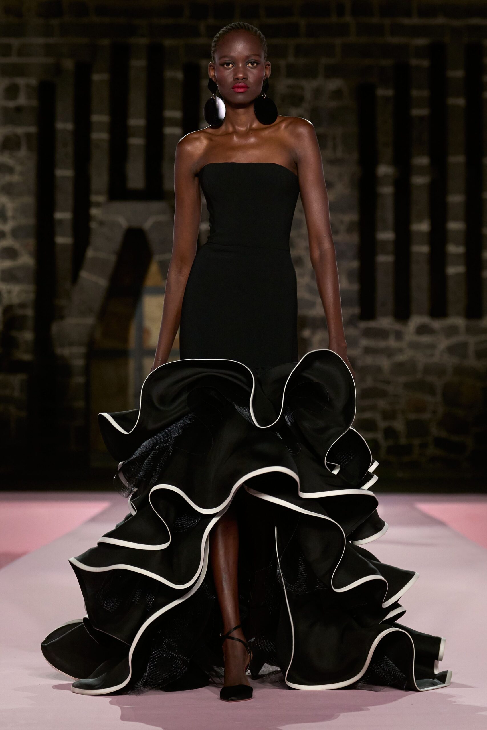 black strapless ruffled gown