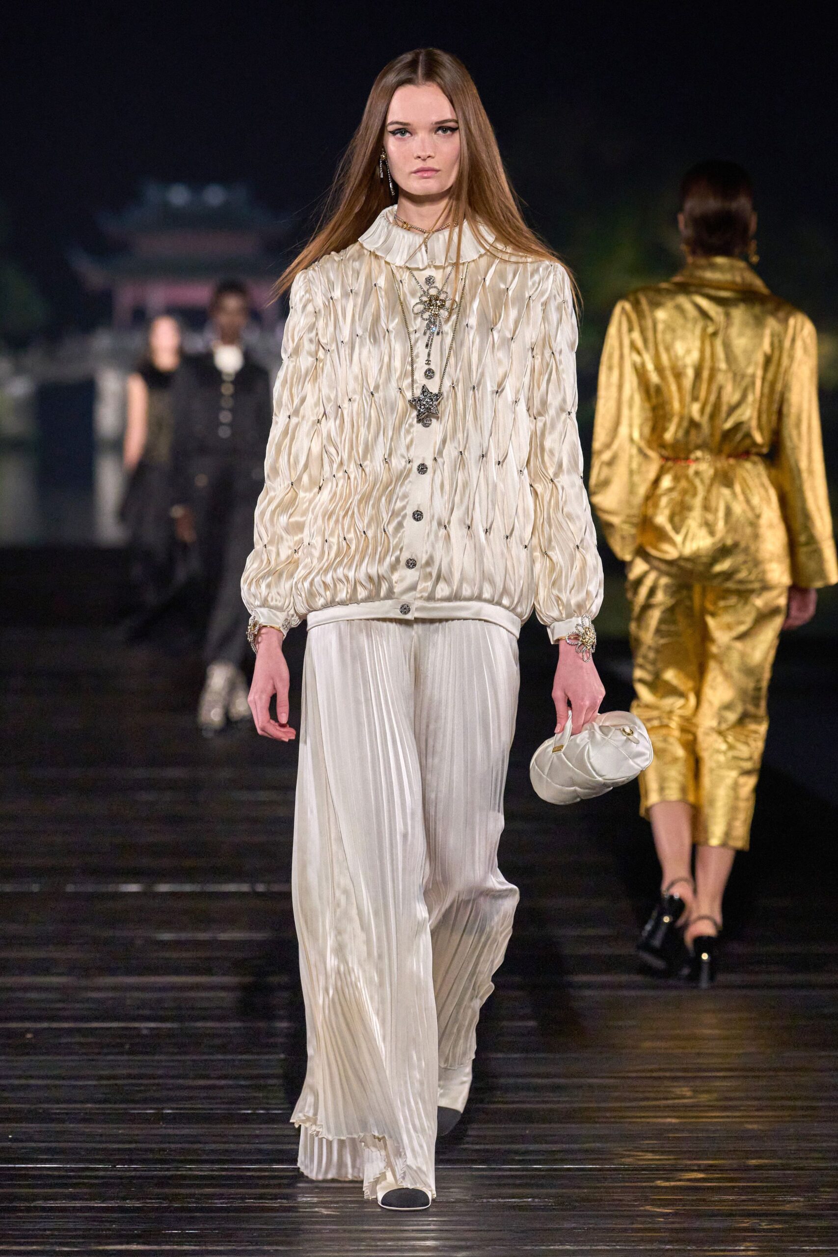 white pleated blouse and pants