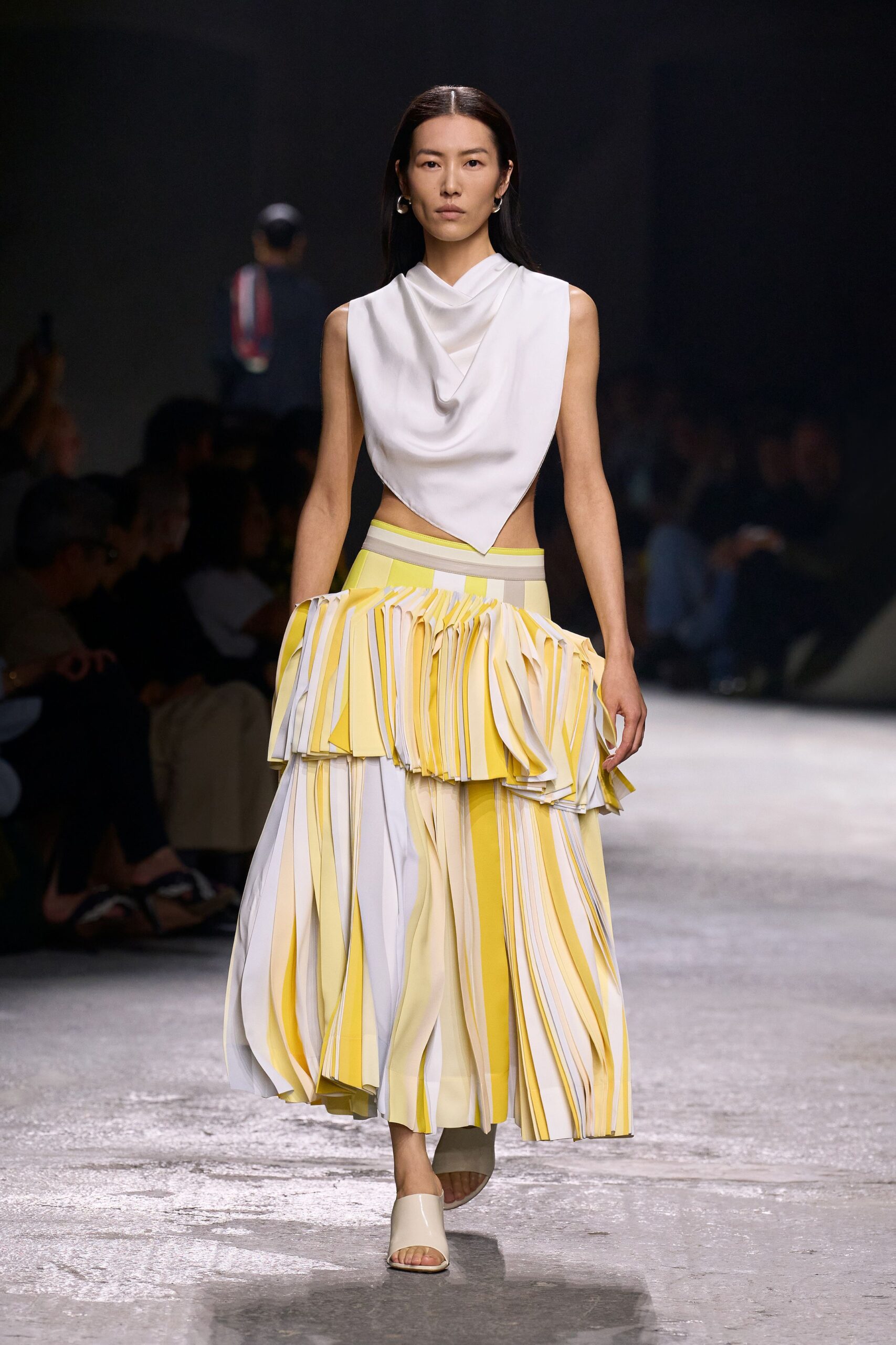 white top yellow pleated skirt