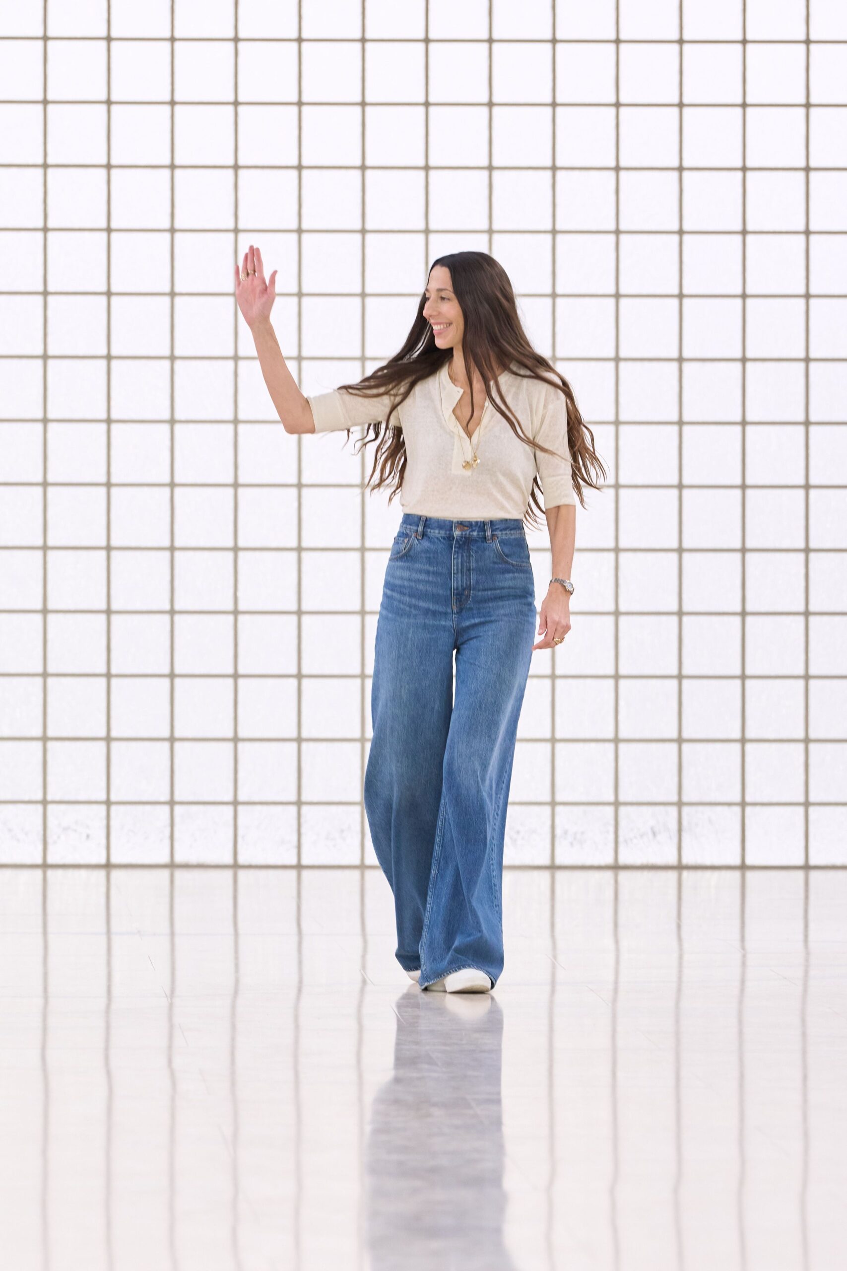 beige relaxed top with blue wide-leg pants