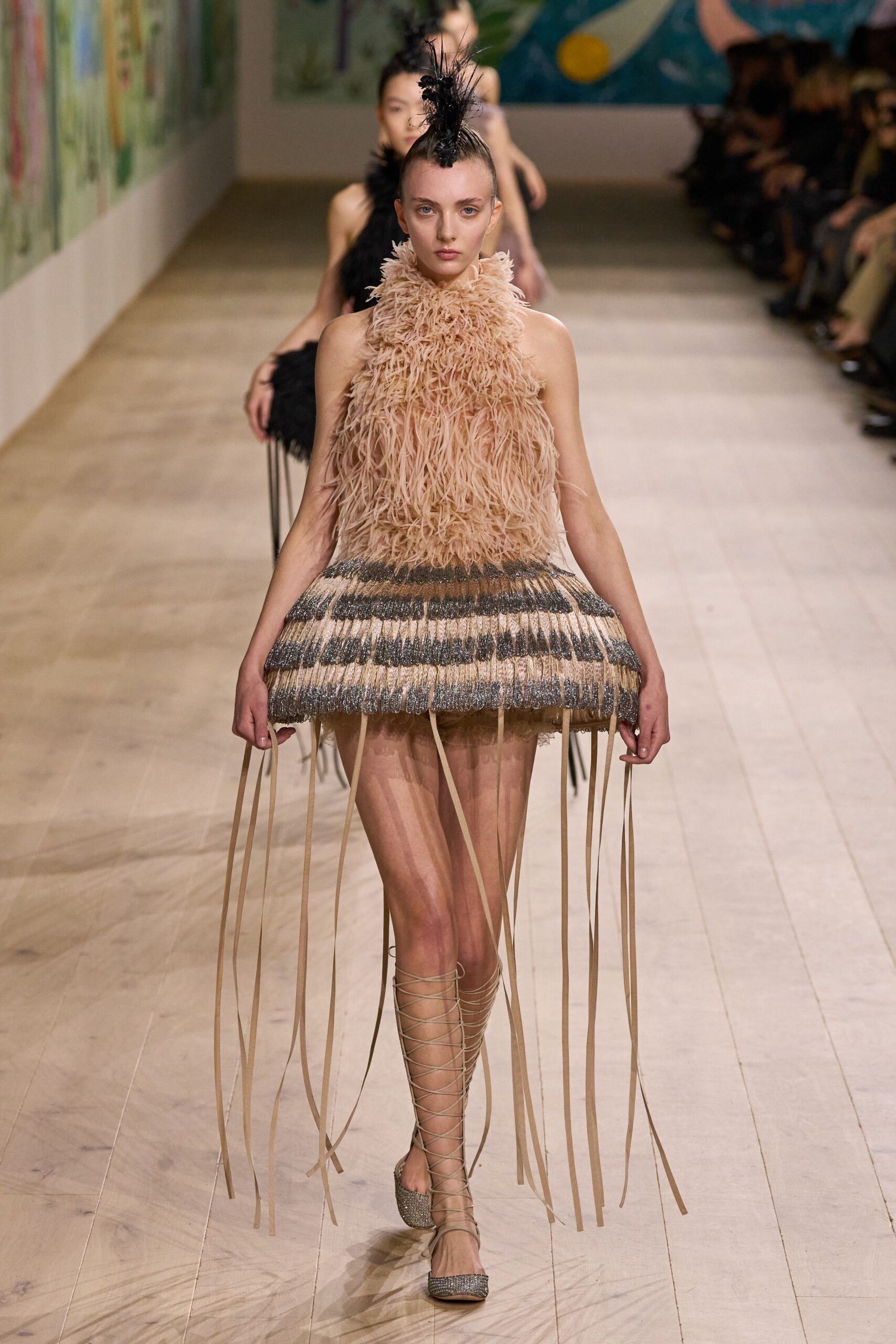 beige feathered mini dress with strappy shoes
