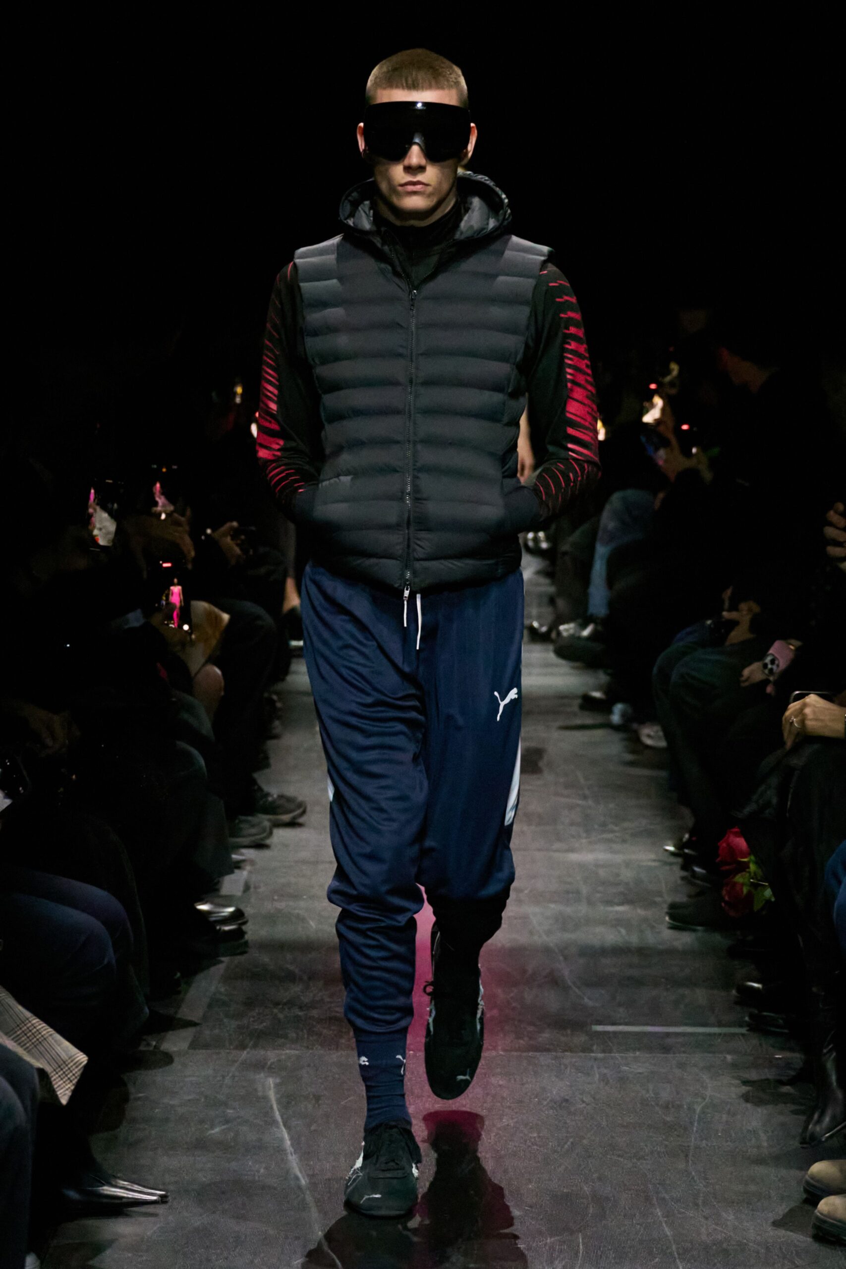 black vest blue pants outfit