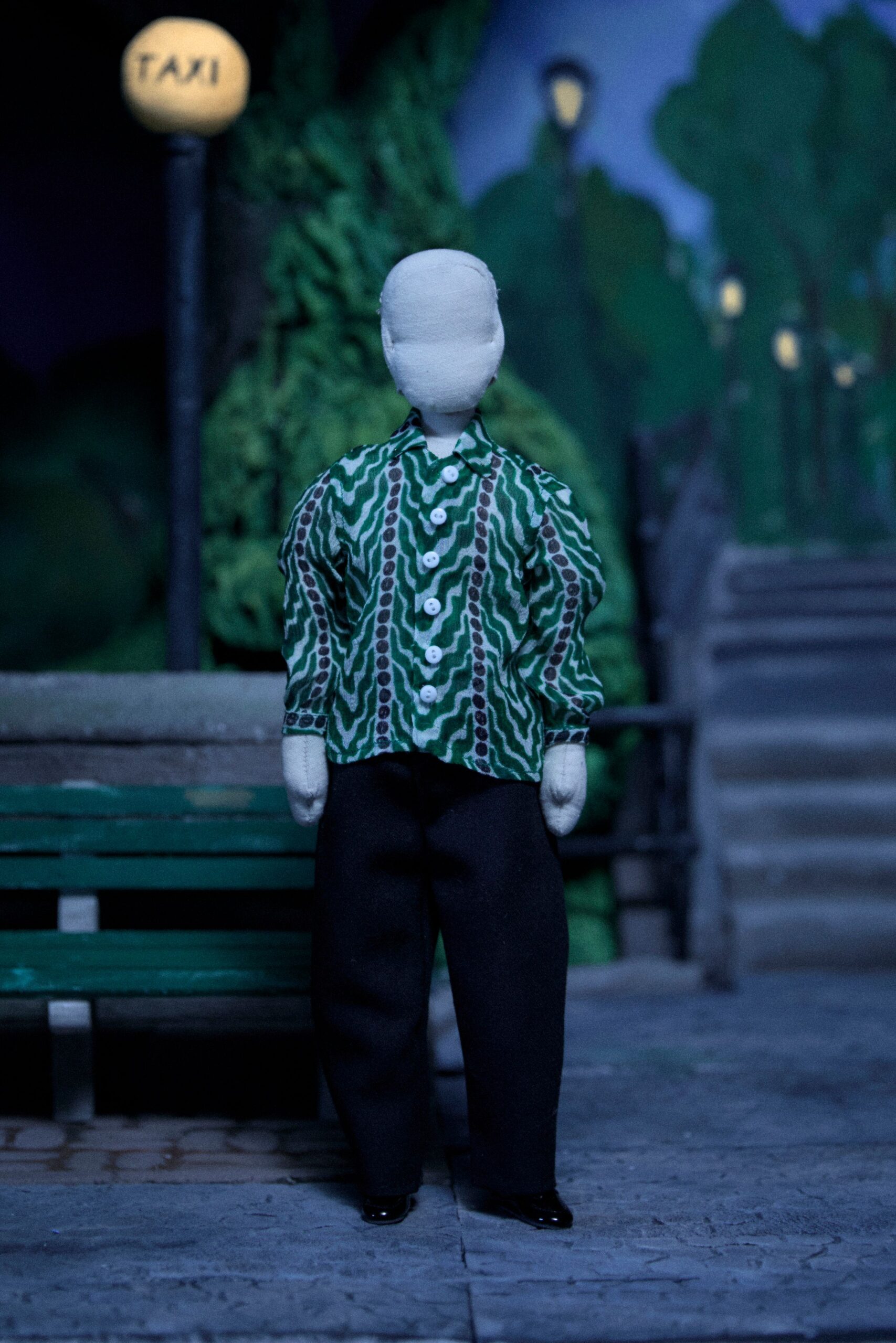 green printed shirt black pants