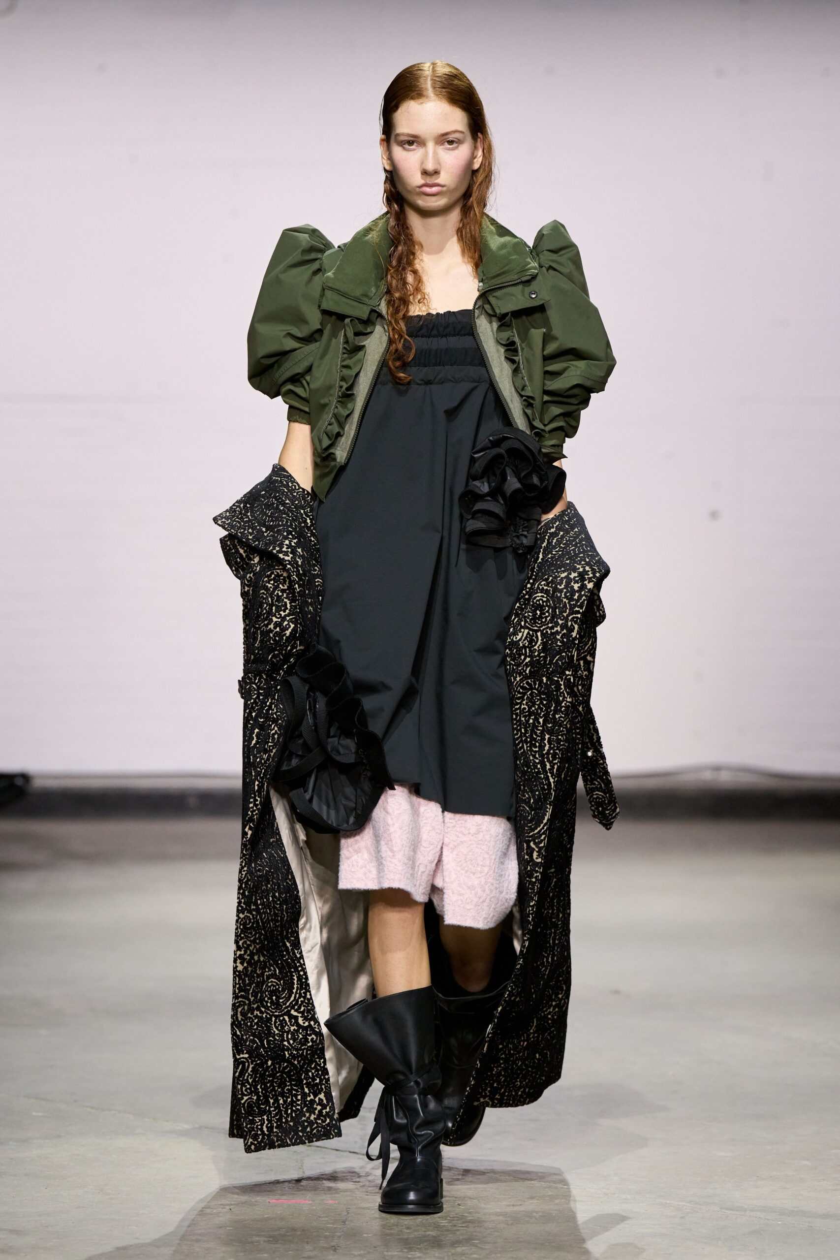 green relaxed jacket black fitted dress