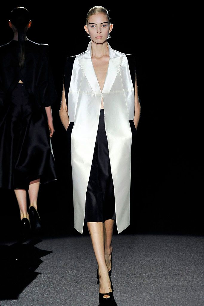 white sleeveless satin overcoat