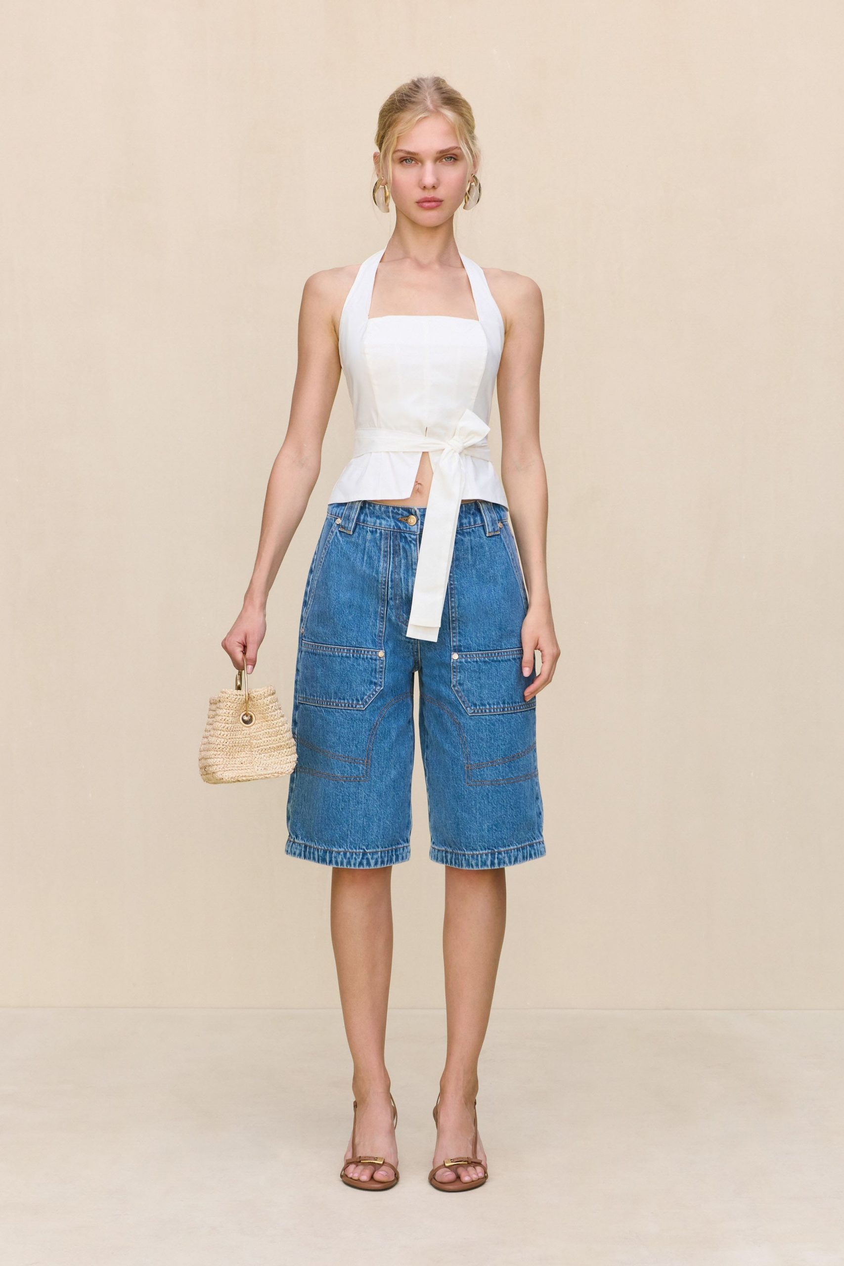 white fitted top with blue cargo shorts