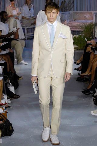 ivory tailored suit with pale blue tie