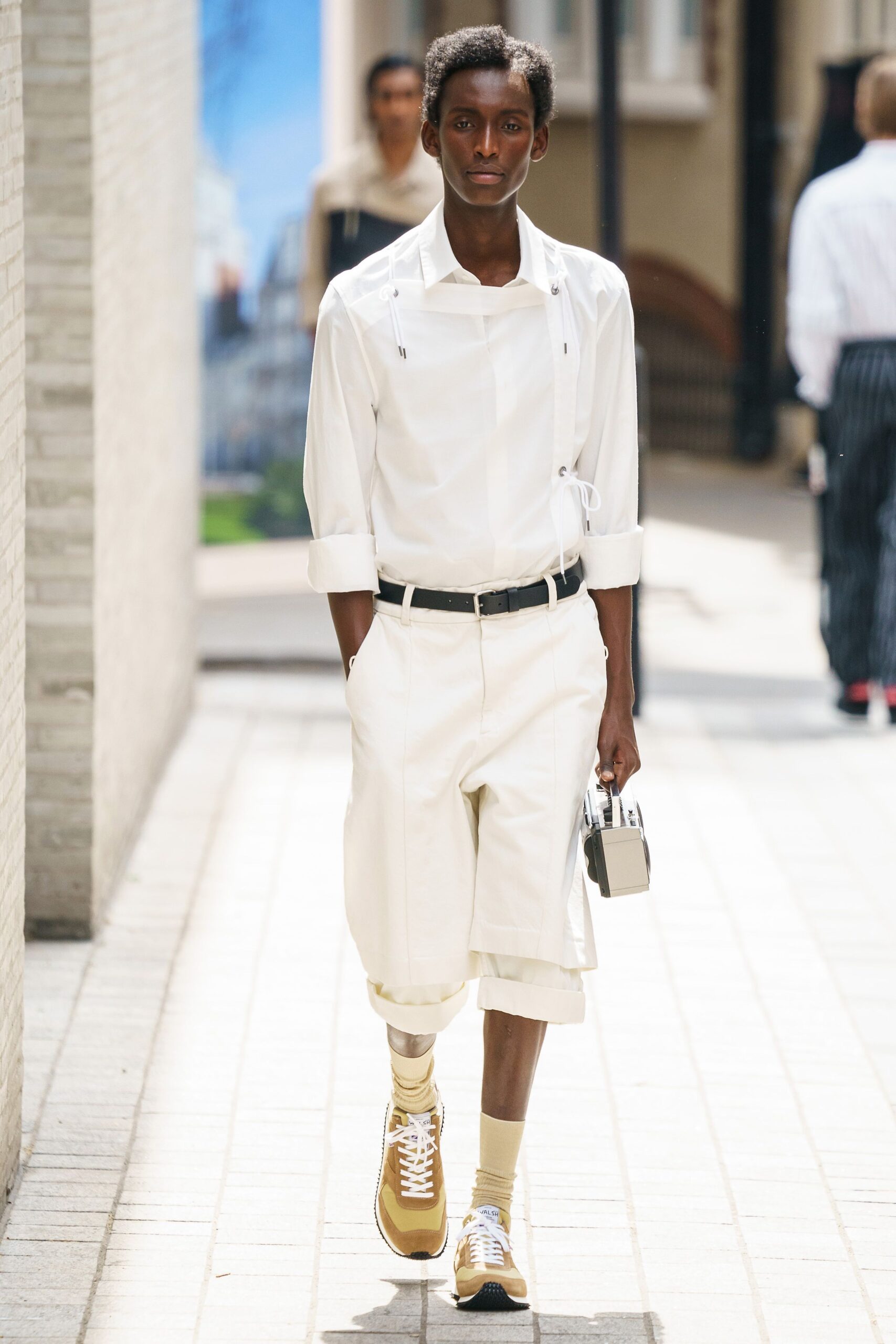 white shirt with long tailored shorts