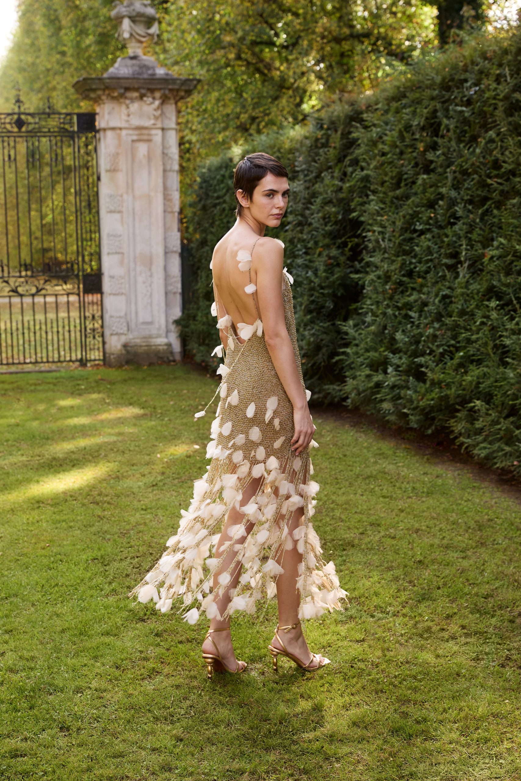 gold ivory fringed gown with sandals