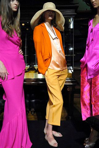 orange blazer with yellow cropped trousers
