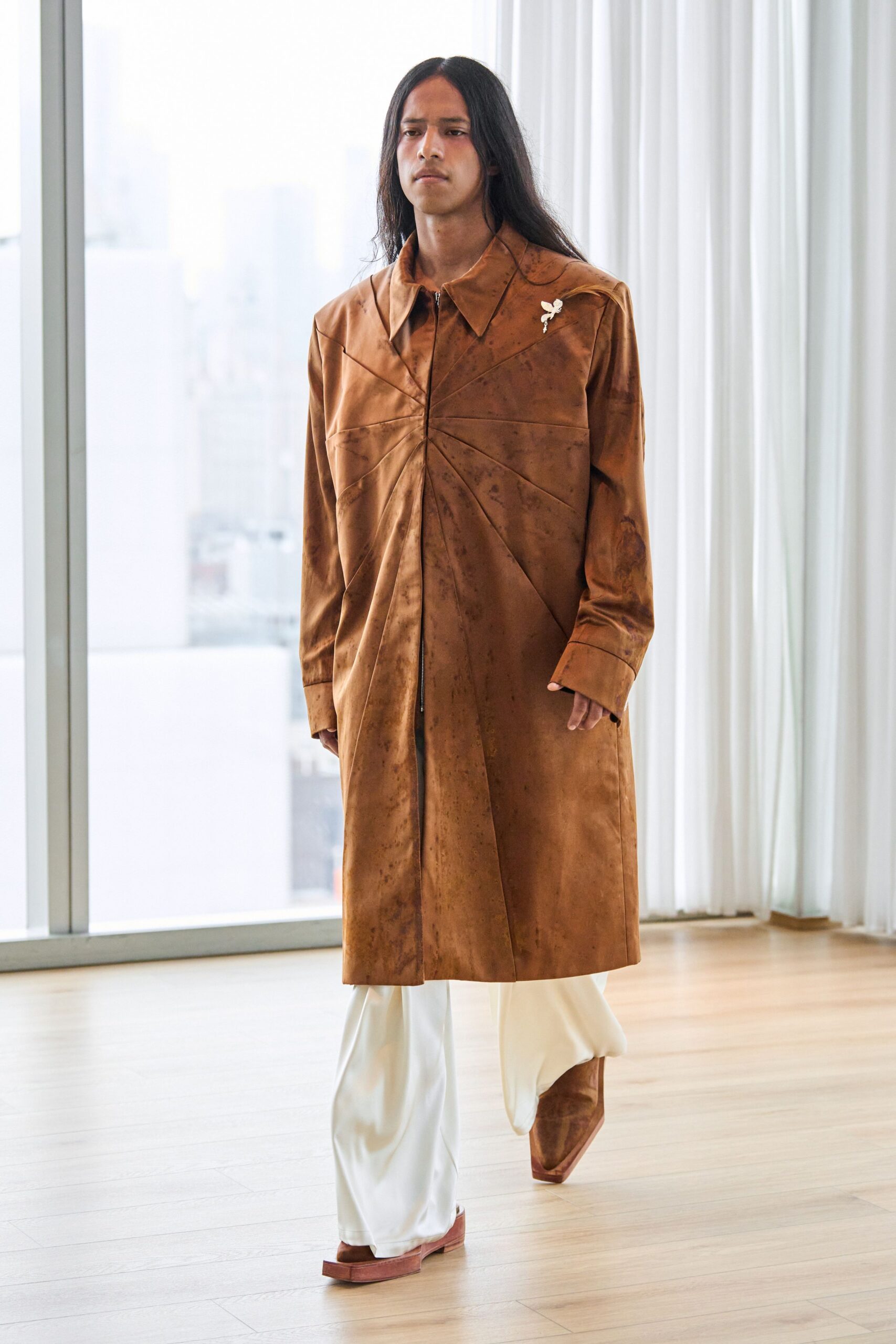 brown leather coat with white pants