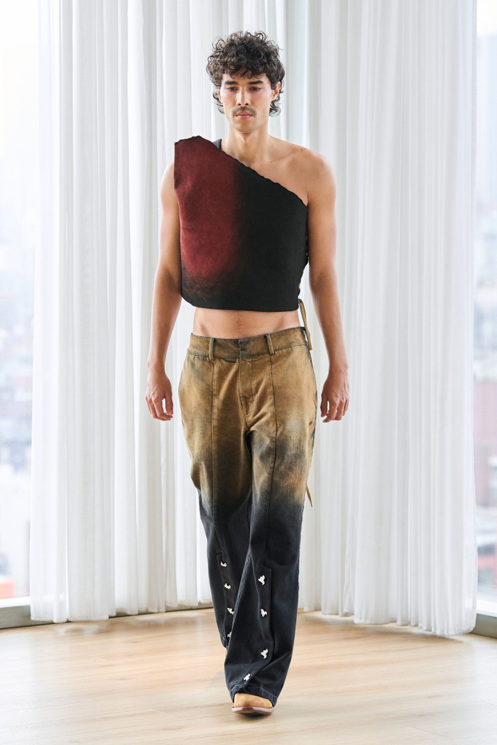 asymmetric black and red top with distressed pants