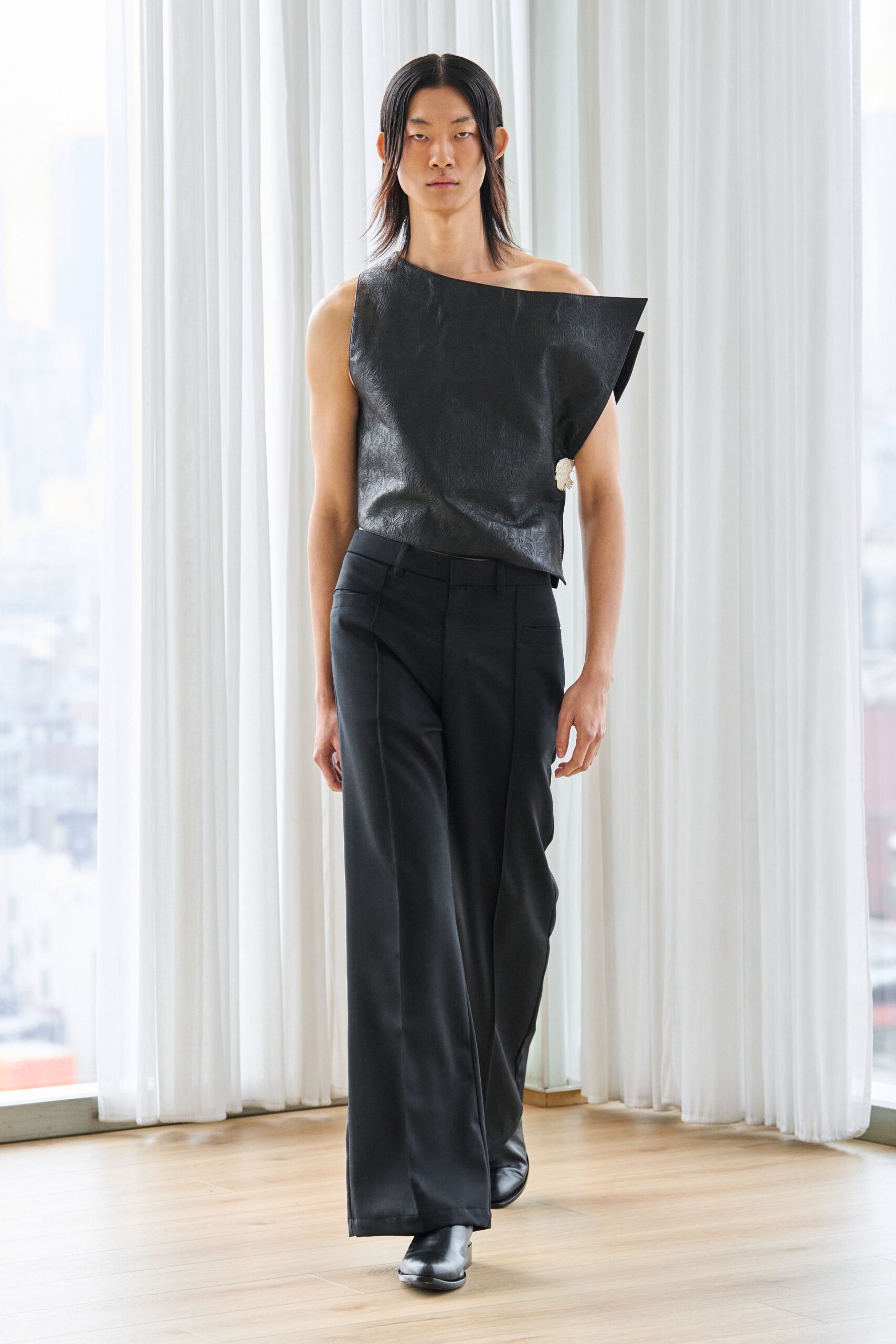 black leather asymmetric top and tailored pants