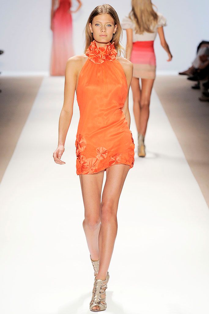 orange halter mini dress with rosettes