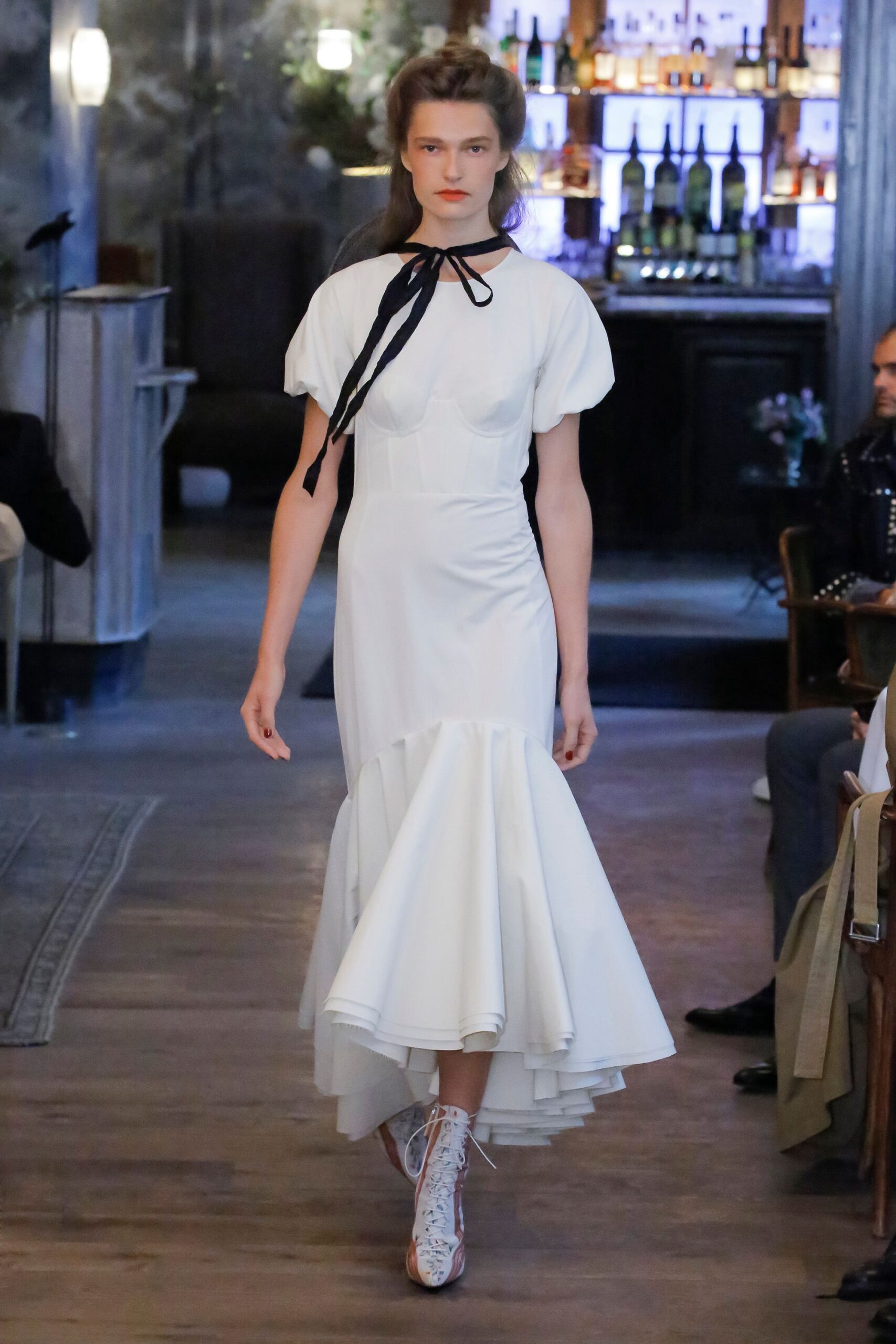 white ruffled high-neck gown