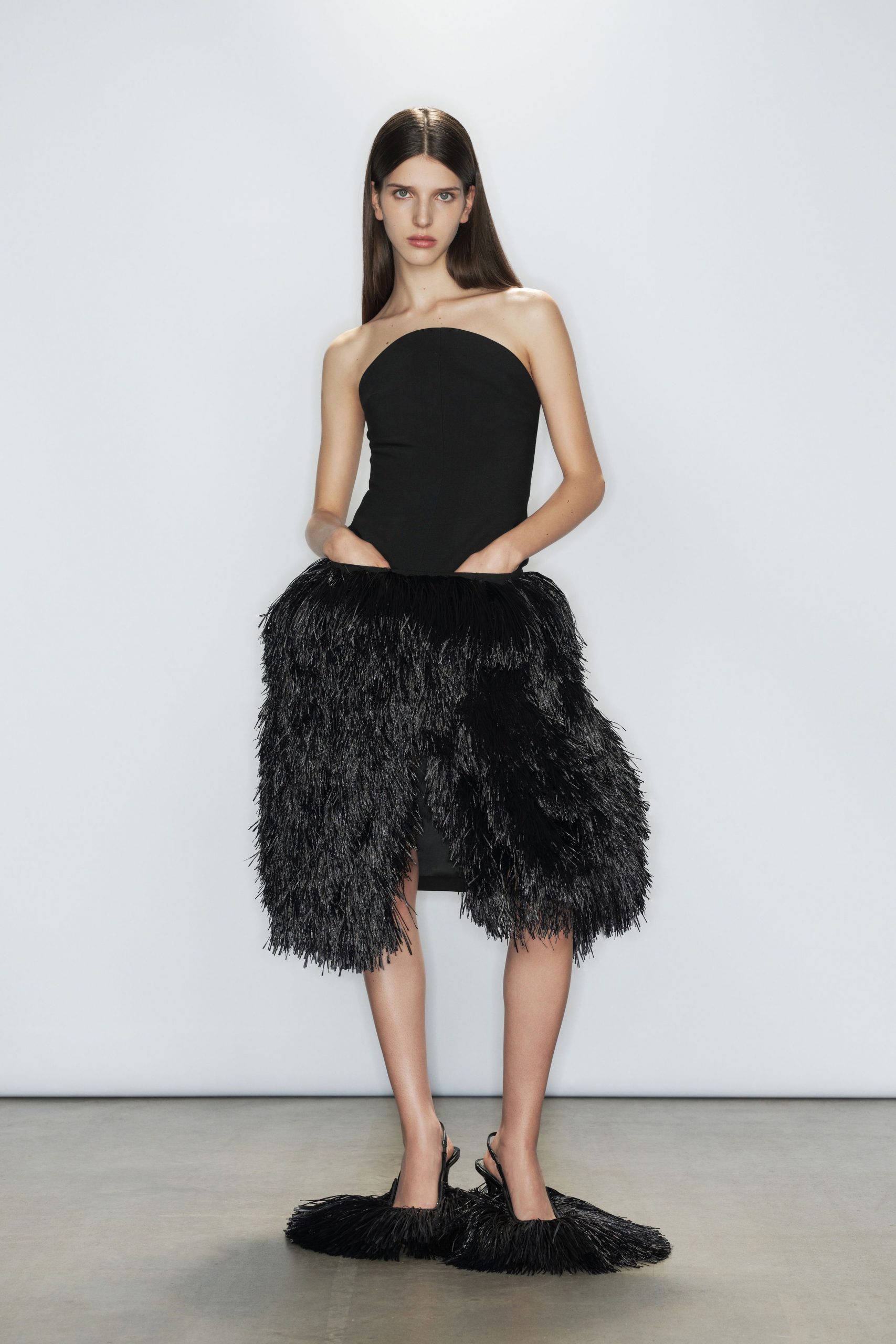 black strapless ruffled dress and shoes