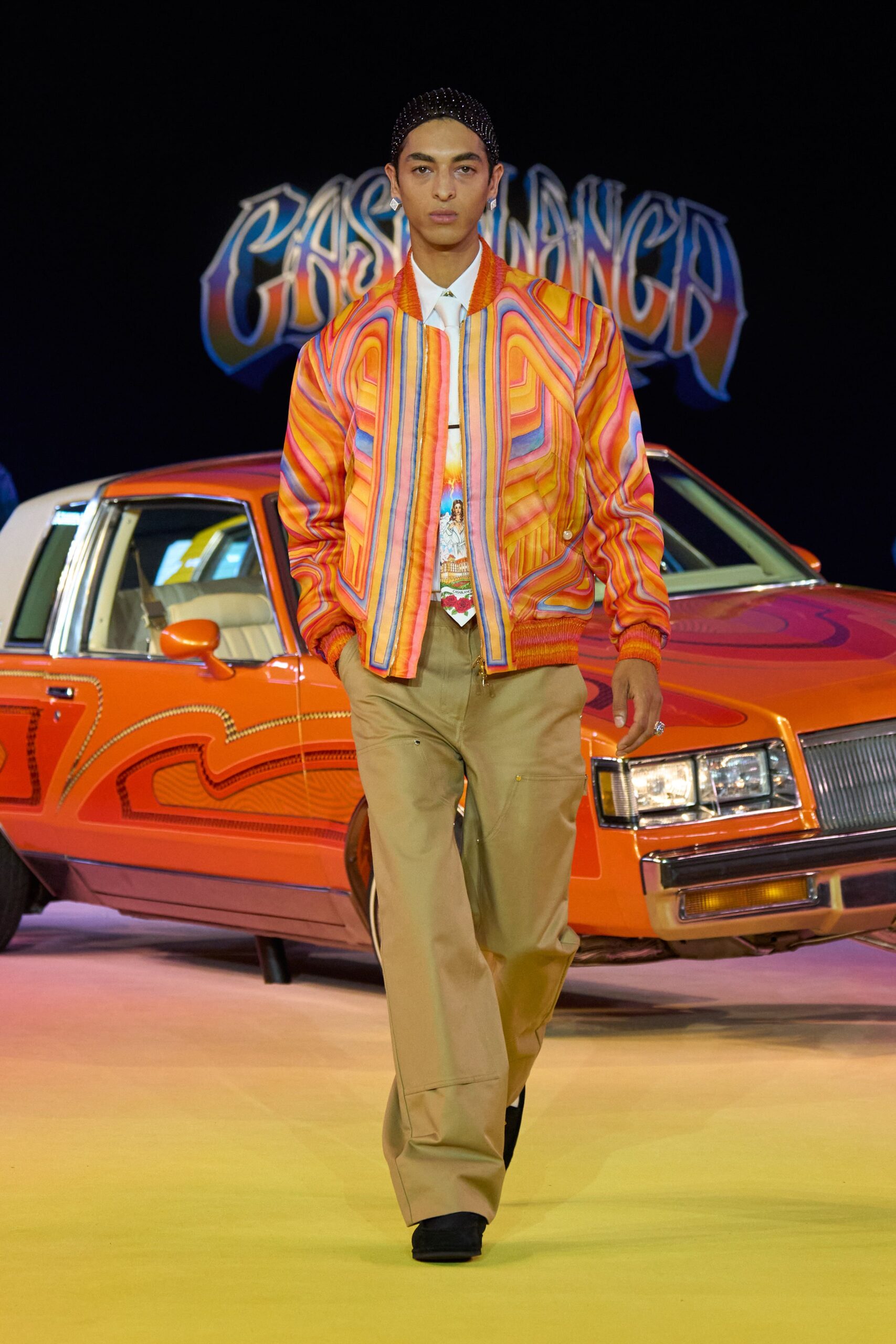 colorful jacket with beige pants