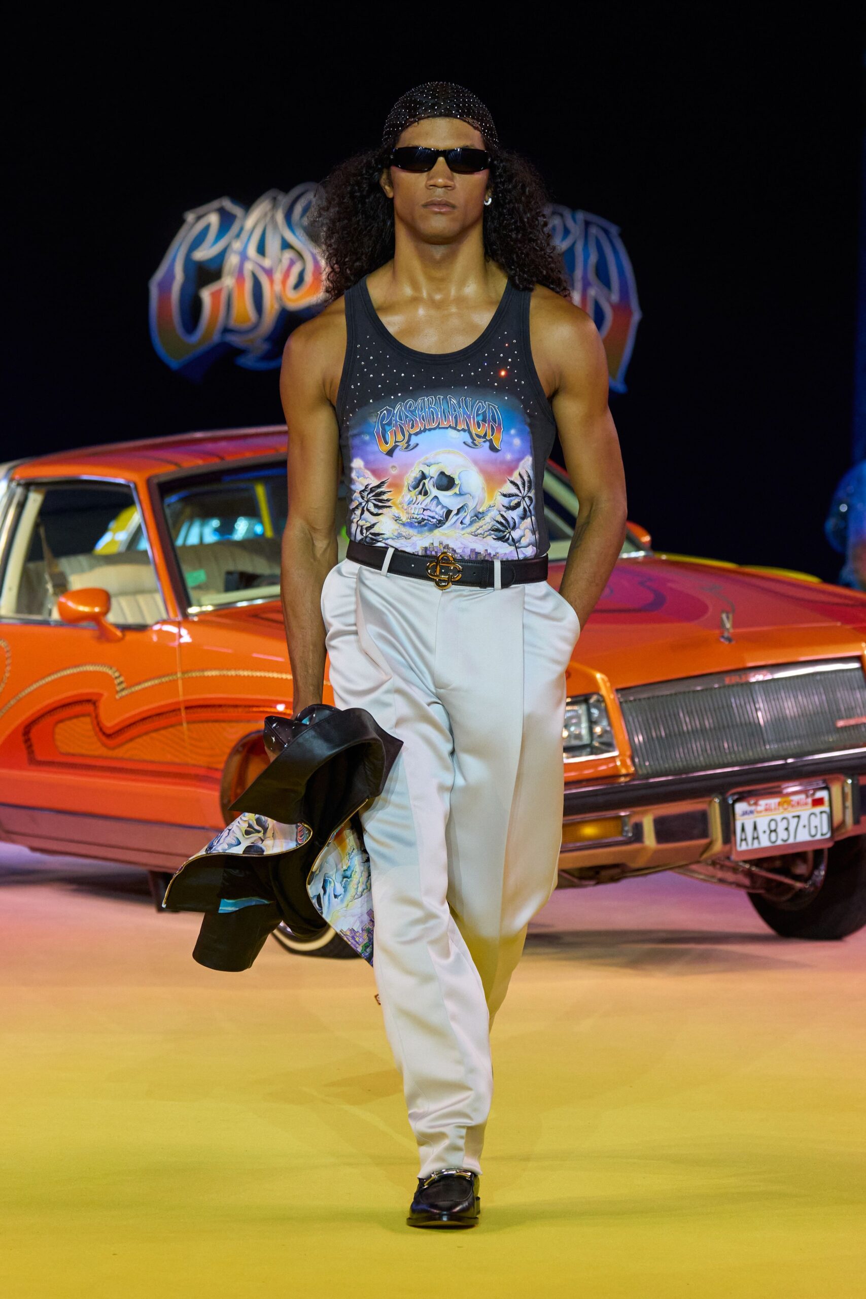 black tank-top white tailored pants
