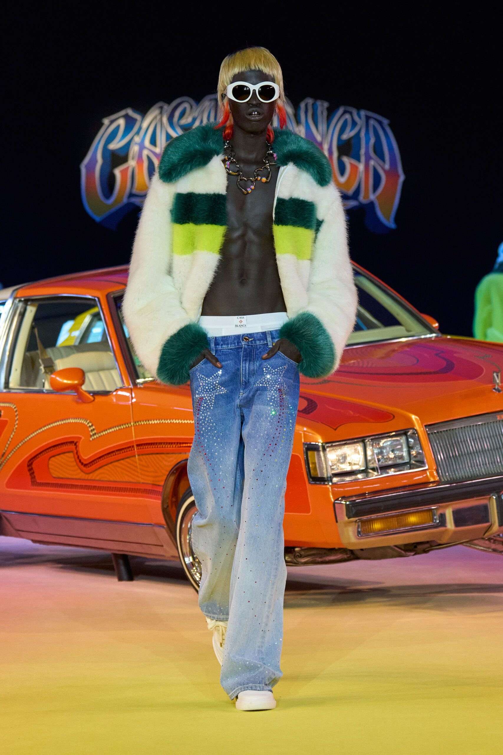 color-blocked fur coat with distressed jeans