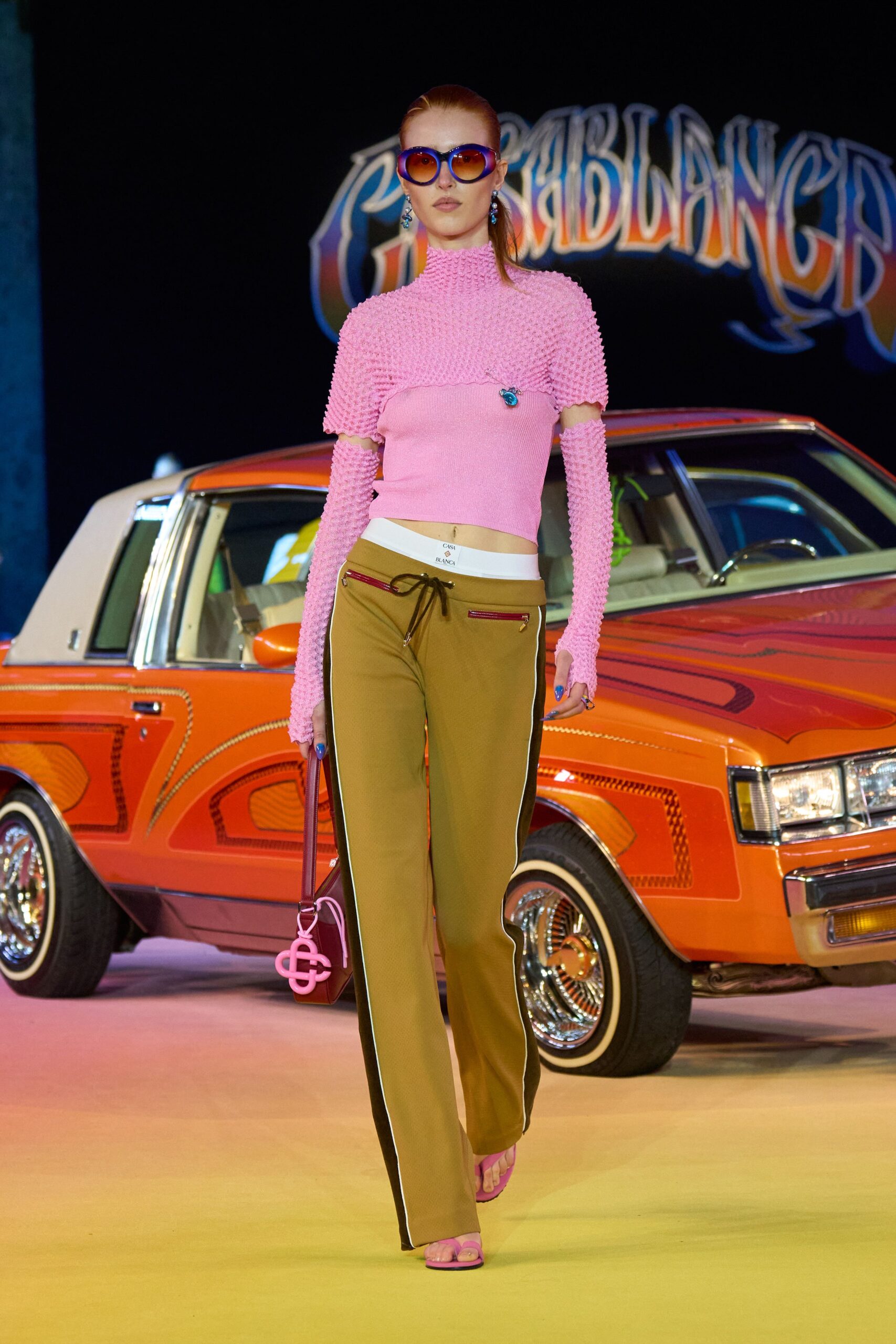 pink knit top with relaxed pants