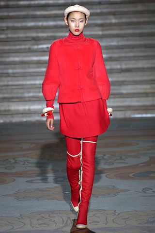 red high-neck jacket and mini skirt