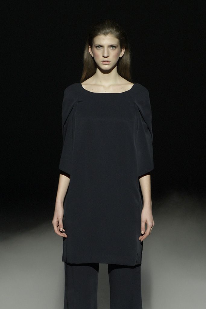 black tunic top and wide-leg pants
