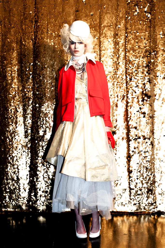 red cropped jacket over metallic dress