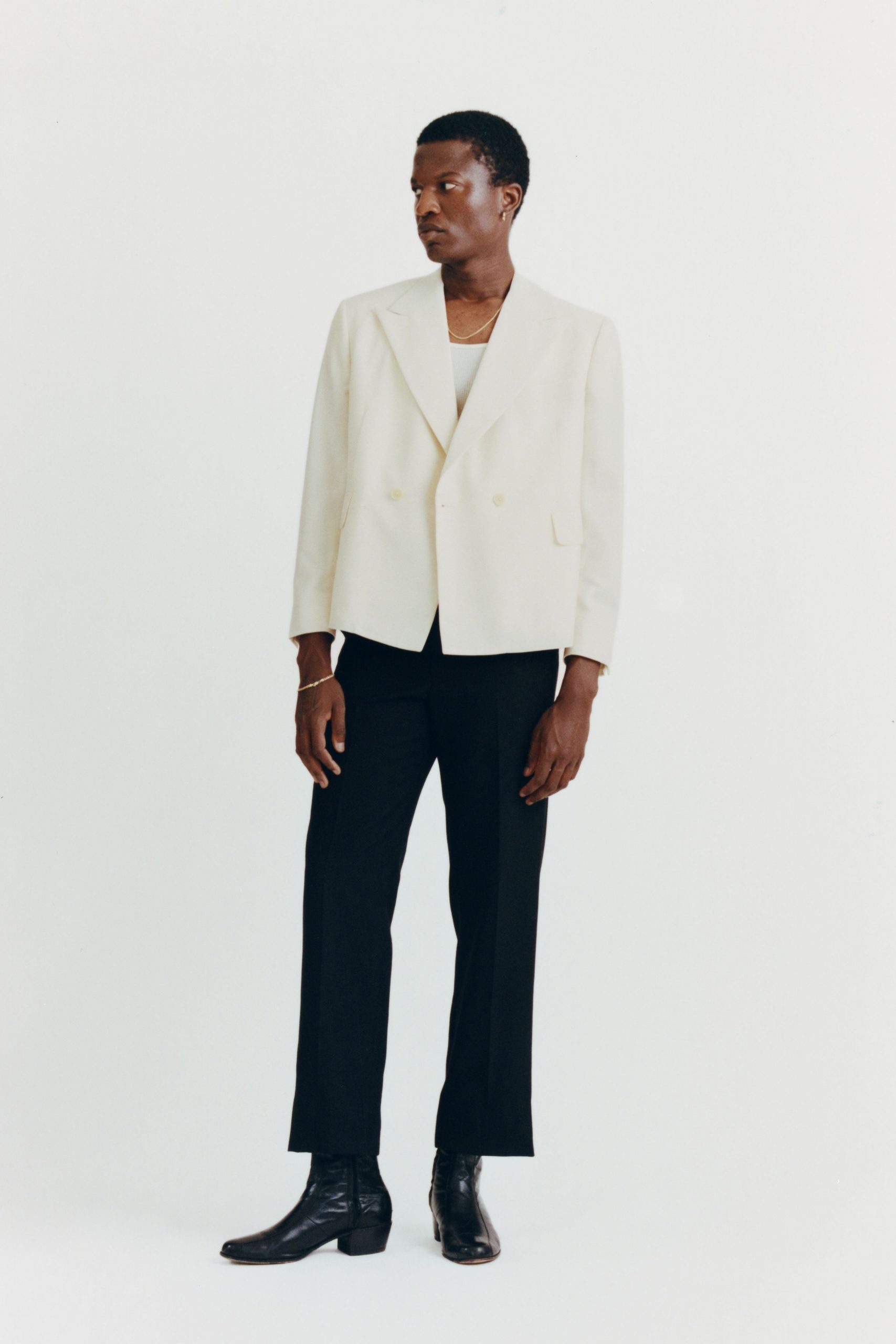 white tailored blazer gray tank-top black pants black boots