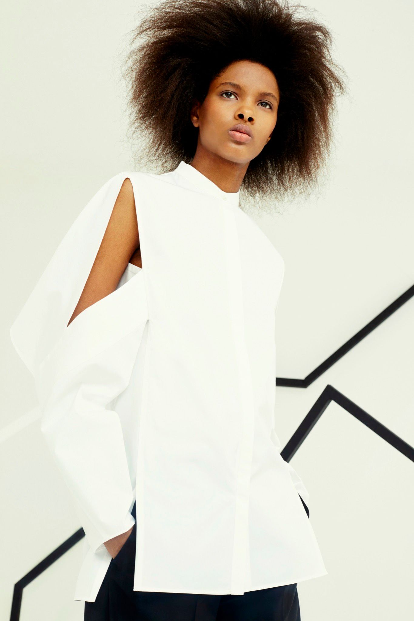 white cape-sleeve high-neck top