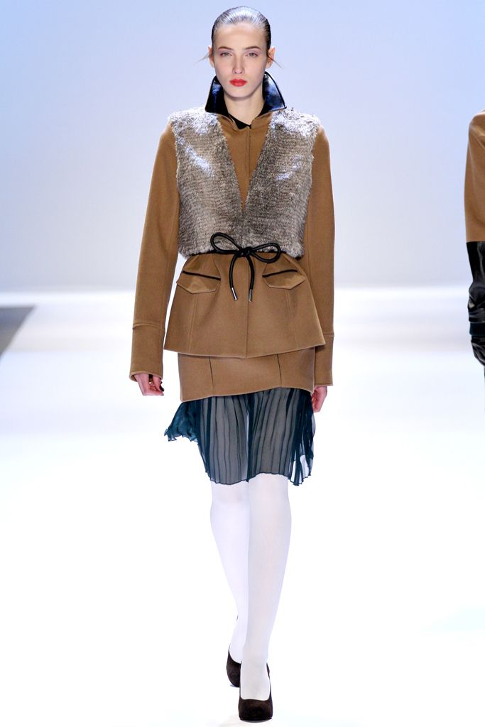 fur vest over peplum jacket
