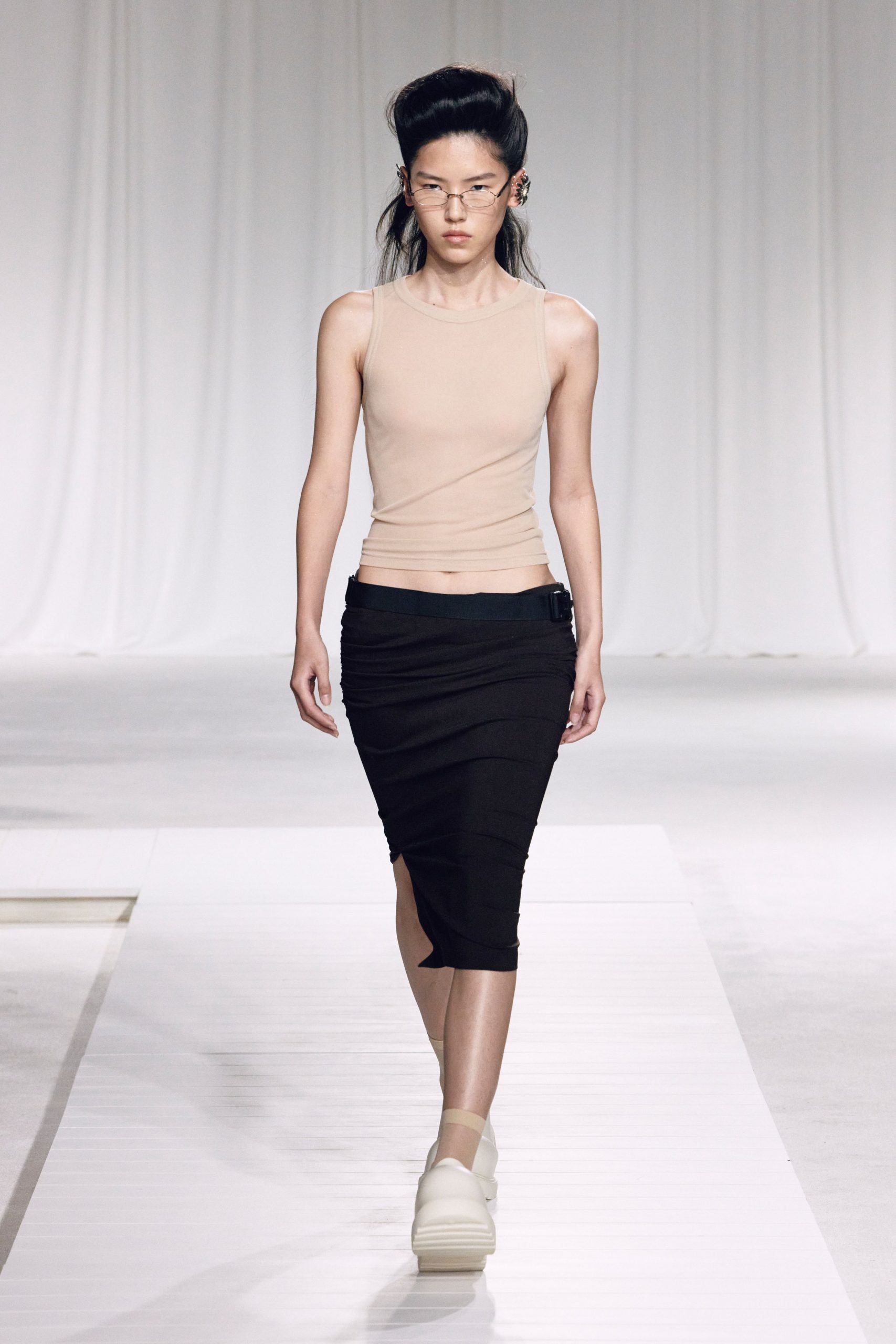 beige fitted top black skirt