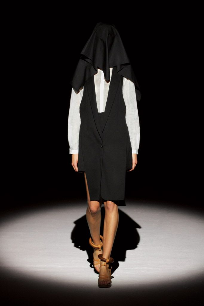 sleeveless black blazer dress over white shirt