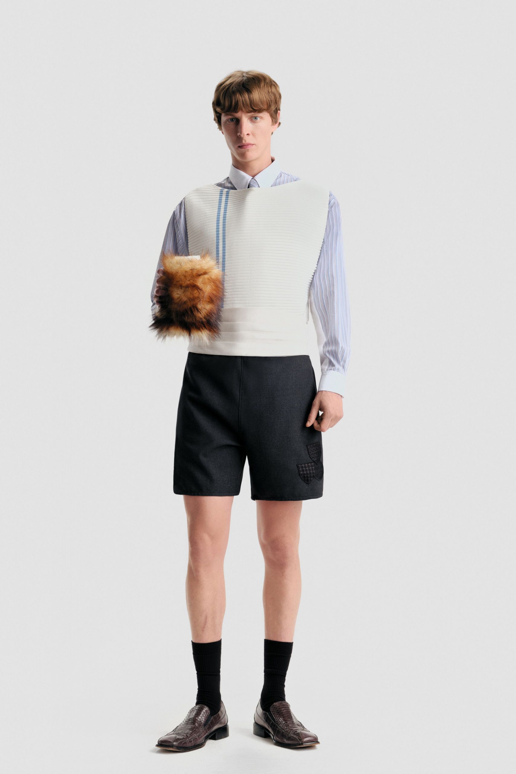 fitted white striped shirt with black shorts