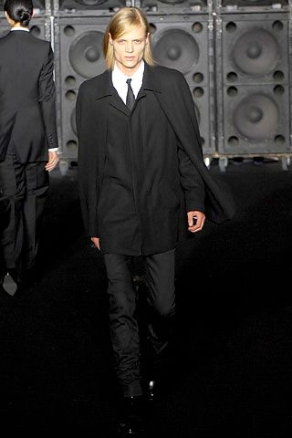 black cape over tailored blazer