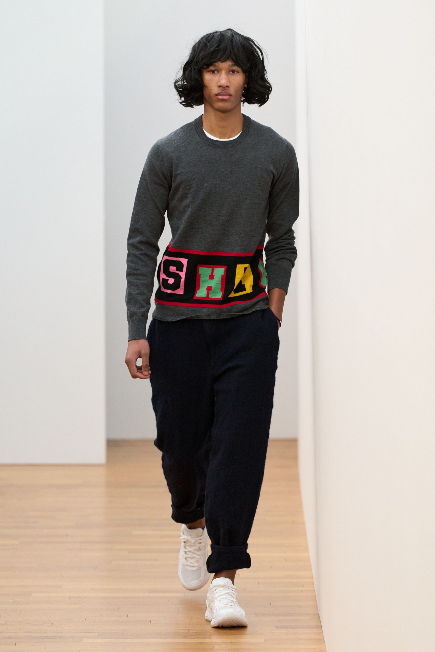 gray relaxed sweater with black pants