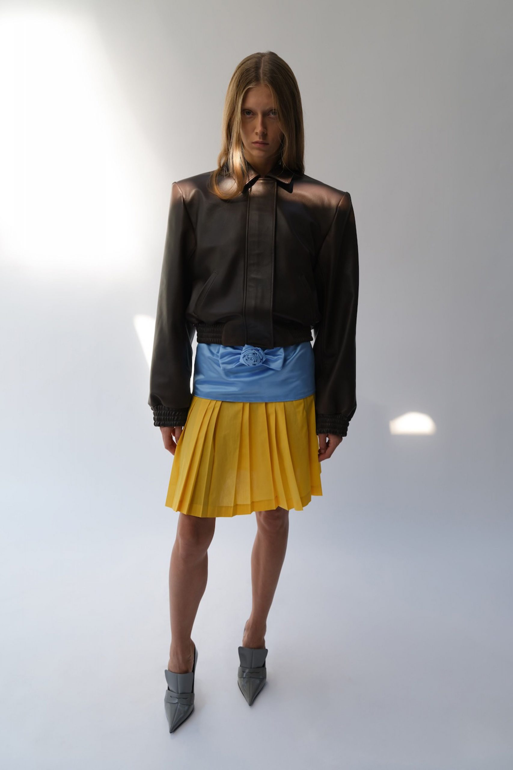 black leather jacket with yellow skirt