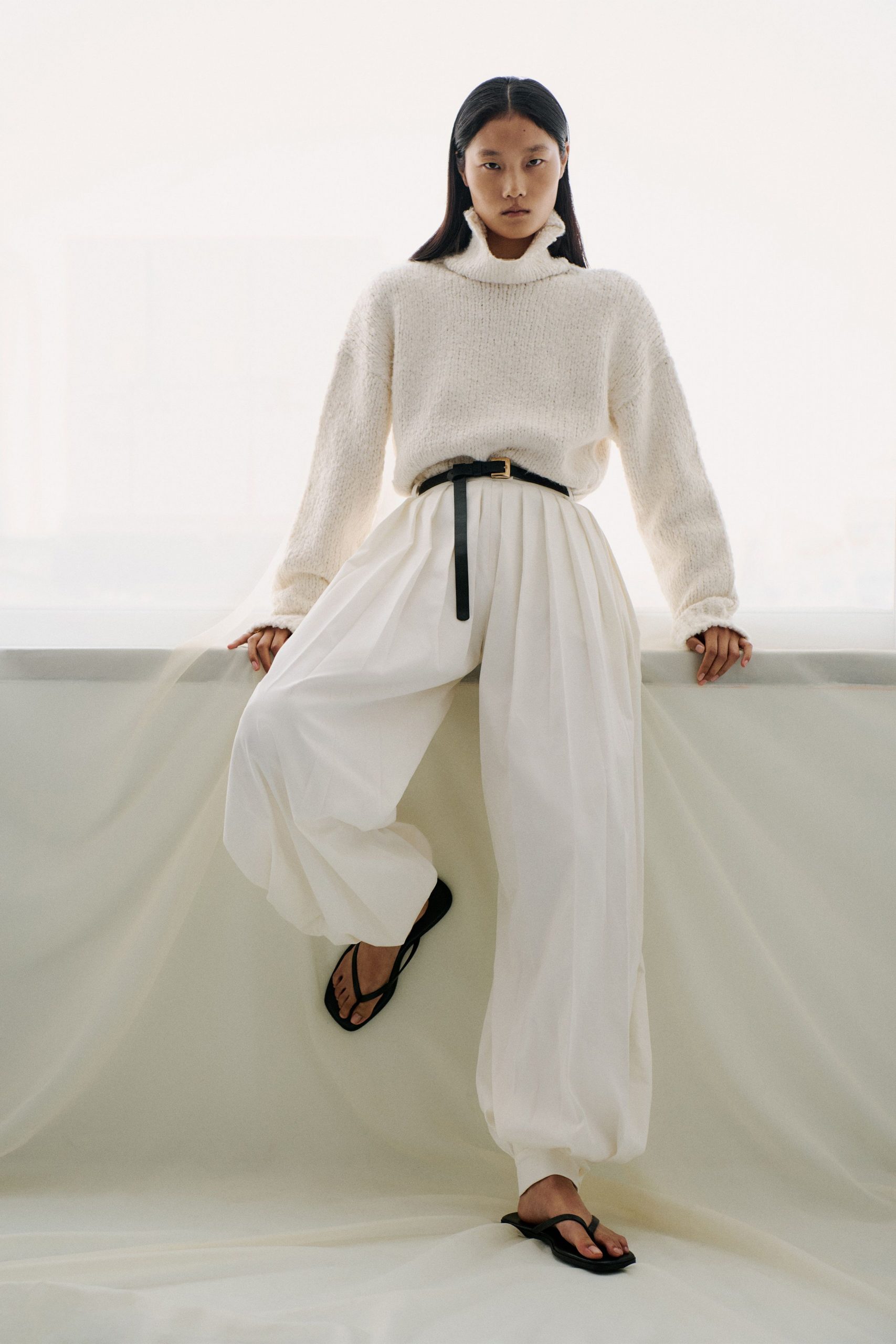 white relaxed sweater and pants