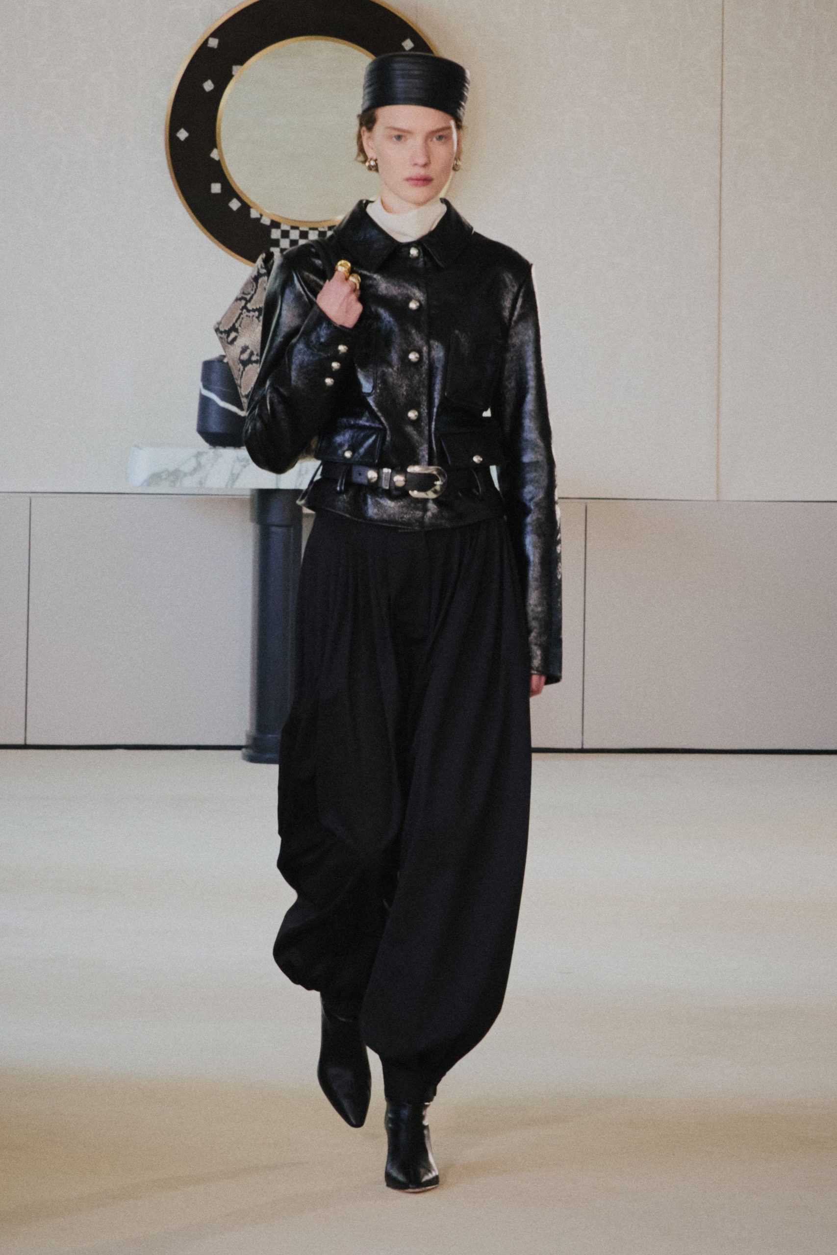 black leather jacket and relaxed pants