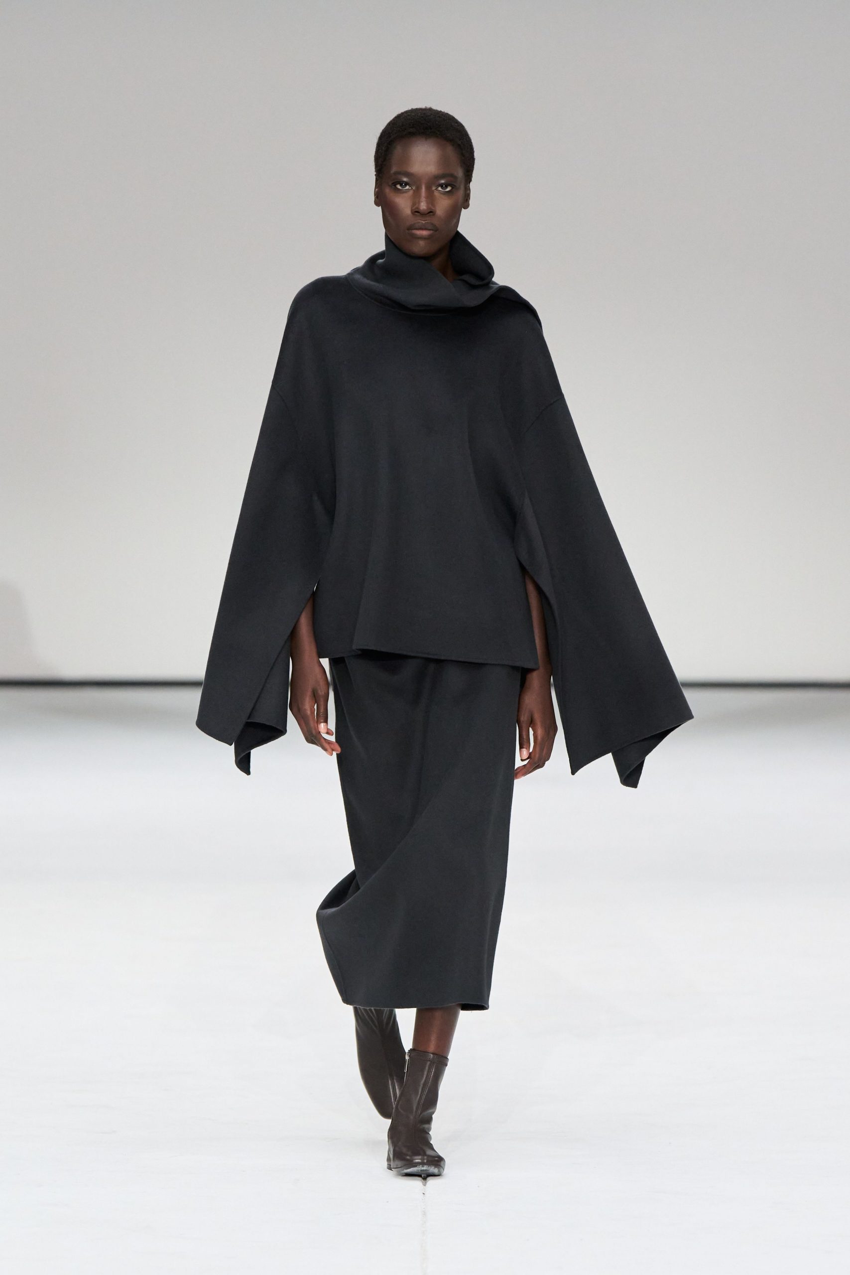black wool top and skirt with boots
