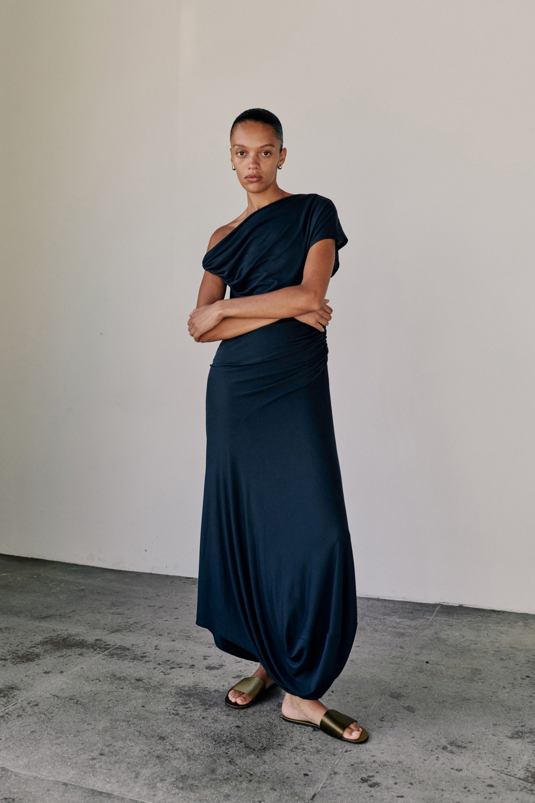 blue silk sleeveless off-shoulder fitted ruched flowing gown
