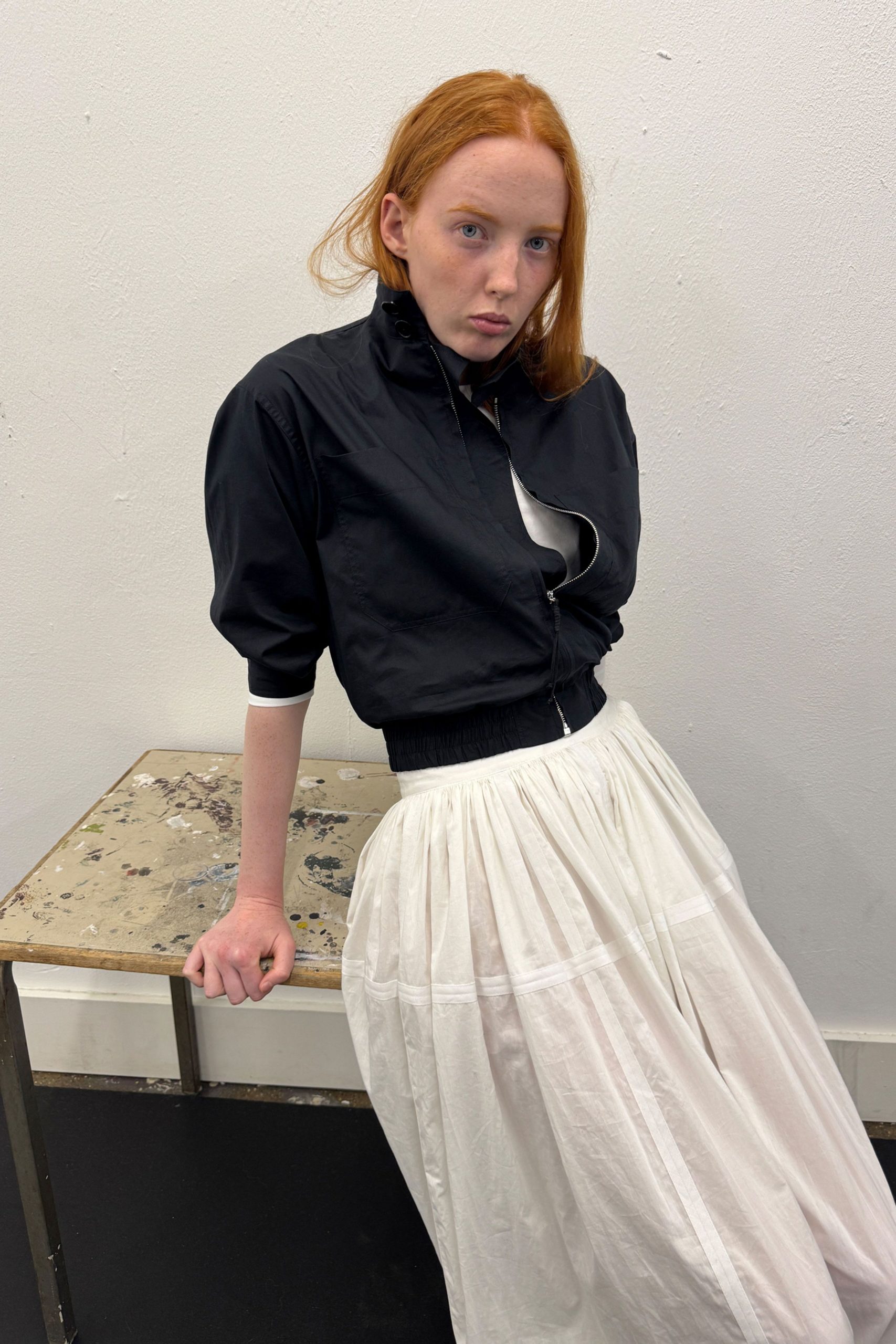 black cotton short-sleeve collared fitted zippered jacket