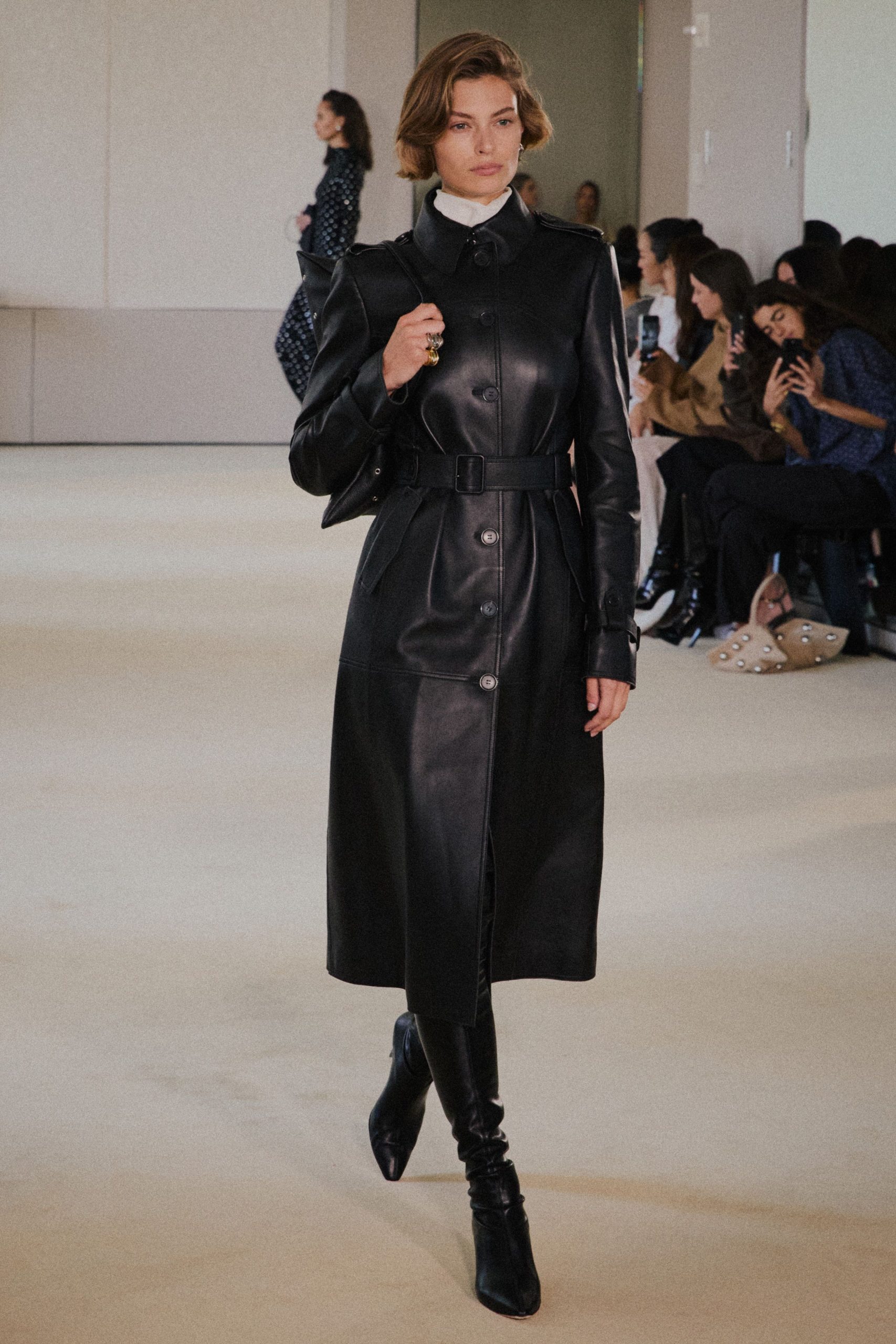 black leather long-sleeve collared fitted buttoned belted coat