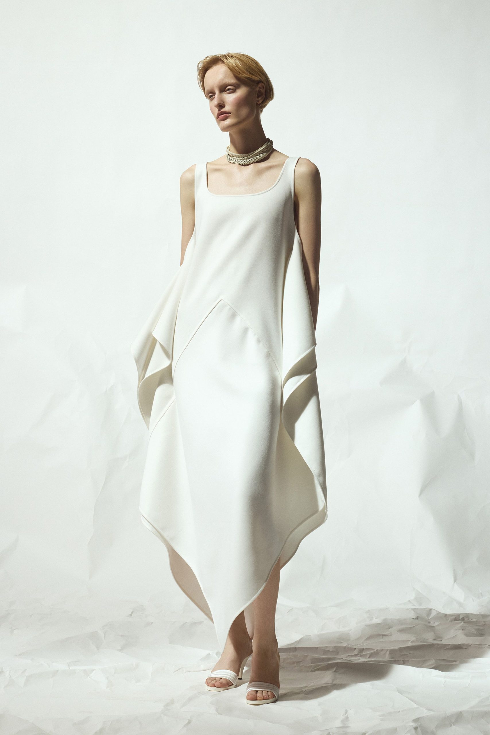 white draped midi dress with open-toe shoes