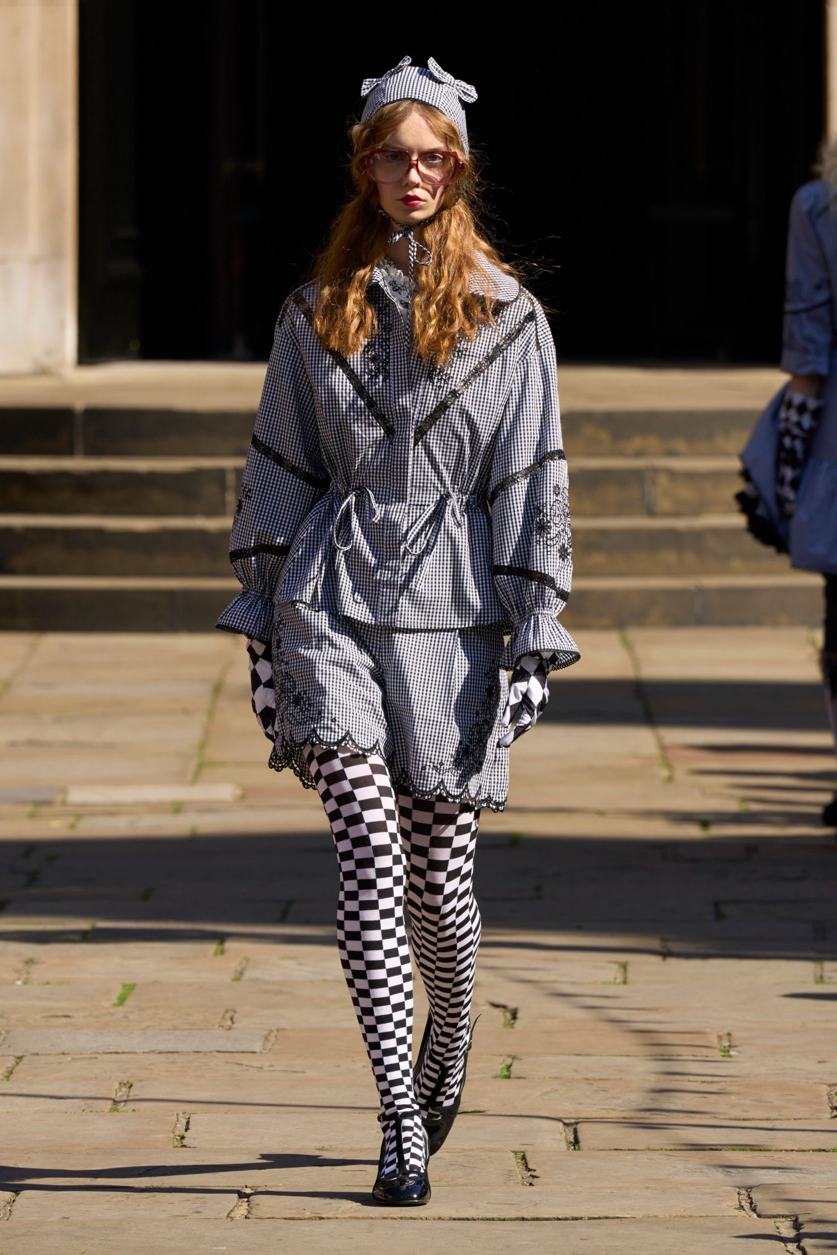 black cotton long-sleeve collared relaxed striped ruffled coat