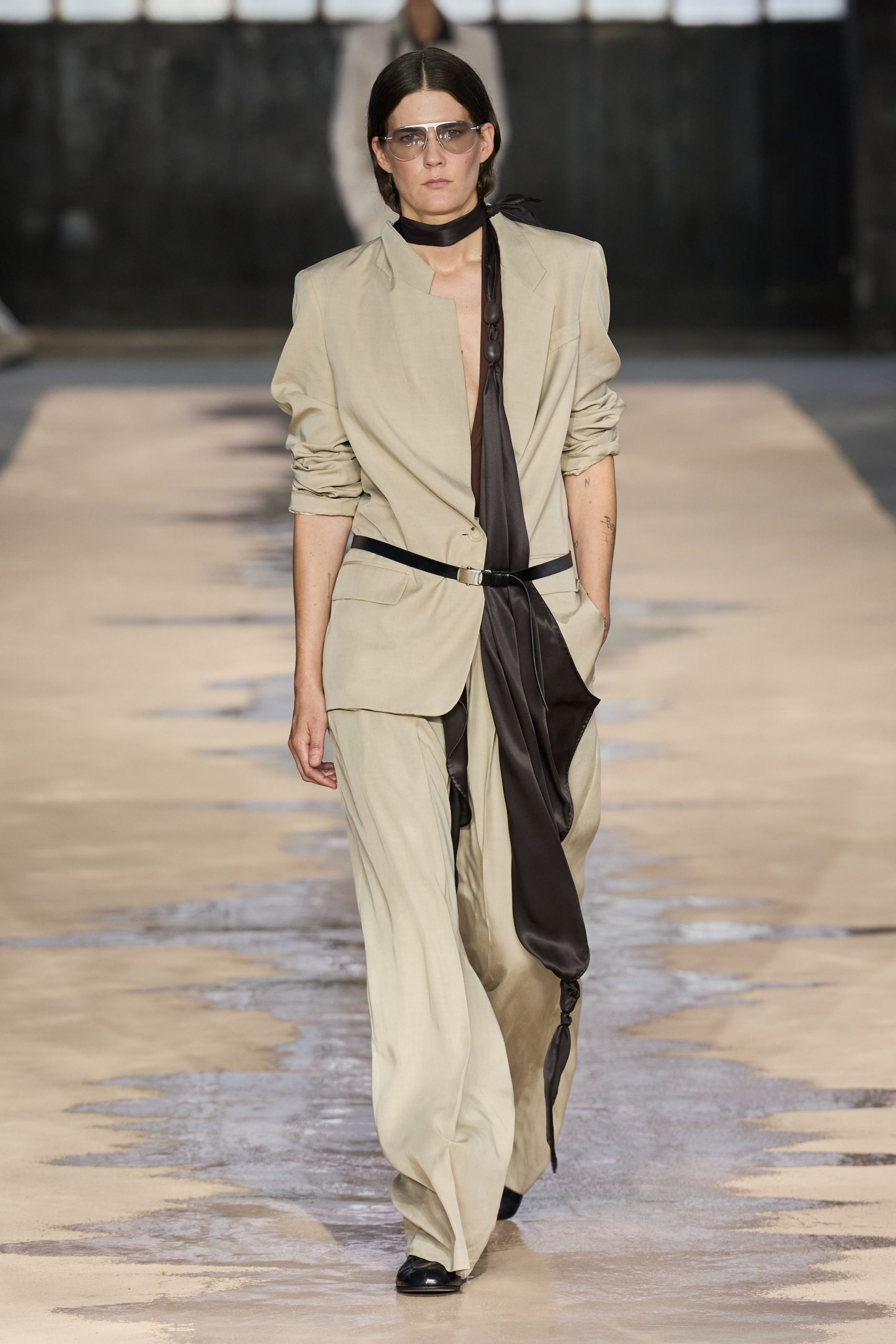 beige blazer black top wide-leg pants