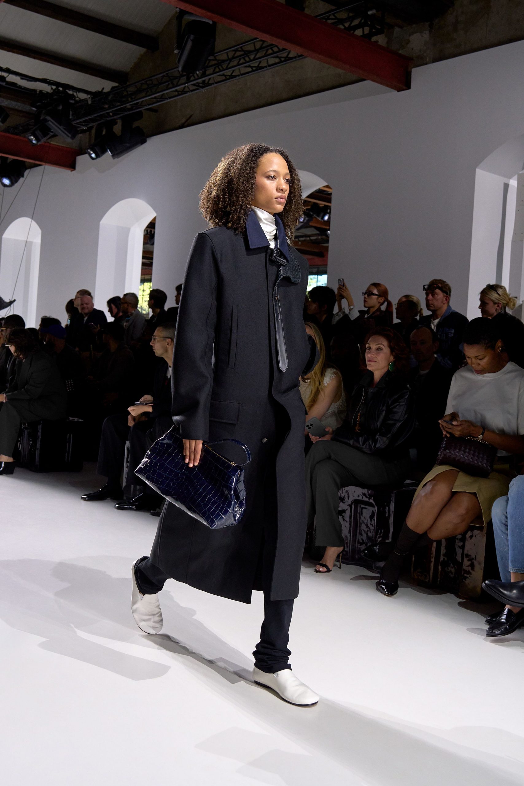 black wool coat with white shoes