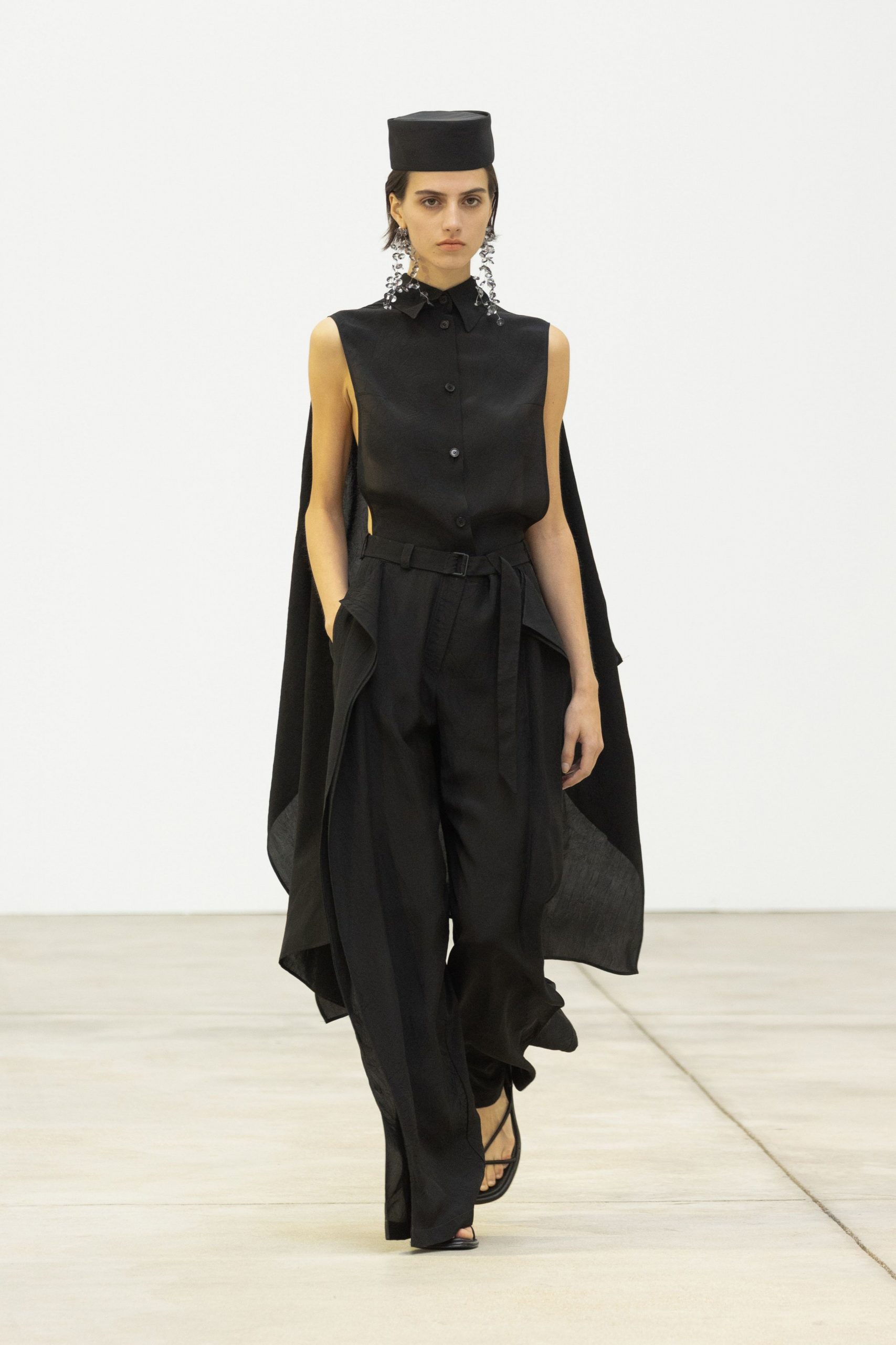 black silk sleeveless collared fitted buttoned layered top